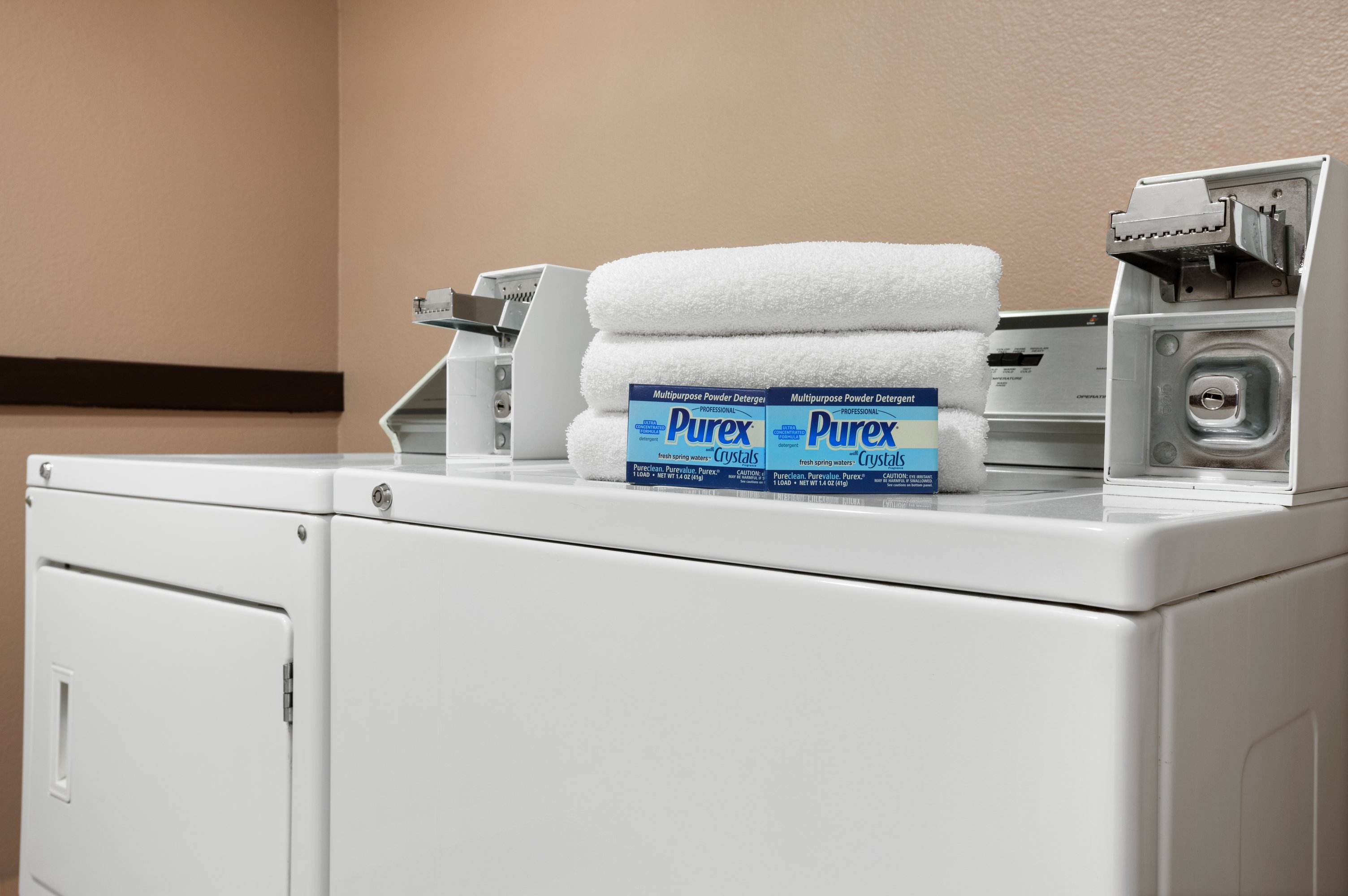 Laundry facilities at Days Inn & Suites by Wyndham Conroe North in Conroe, Texas