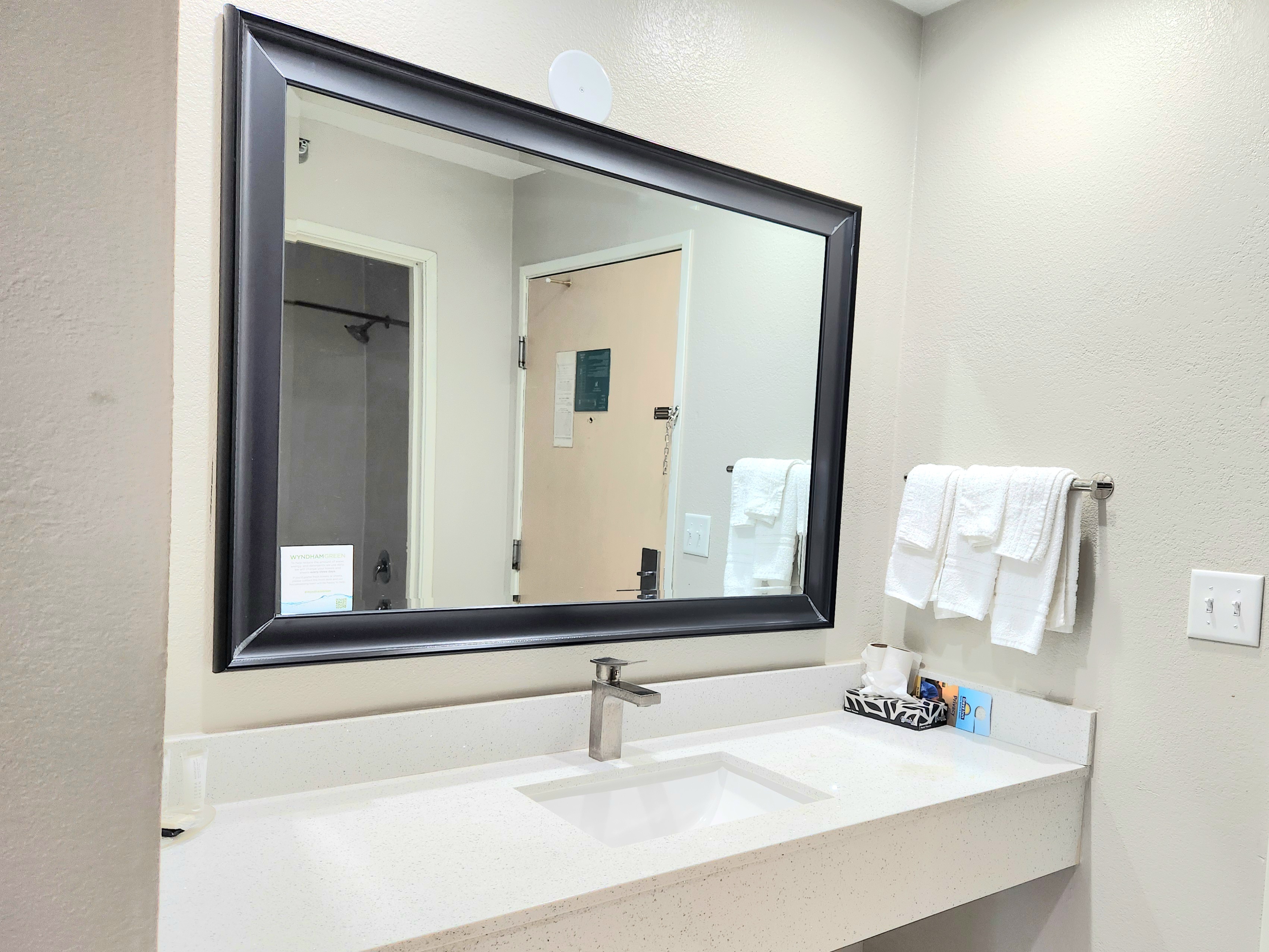 Guest room bath at the Days Inn & Suites by Wyndham Corpus Christi Central in Corpus Christi, Texas