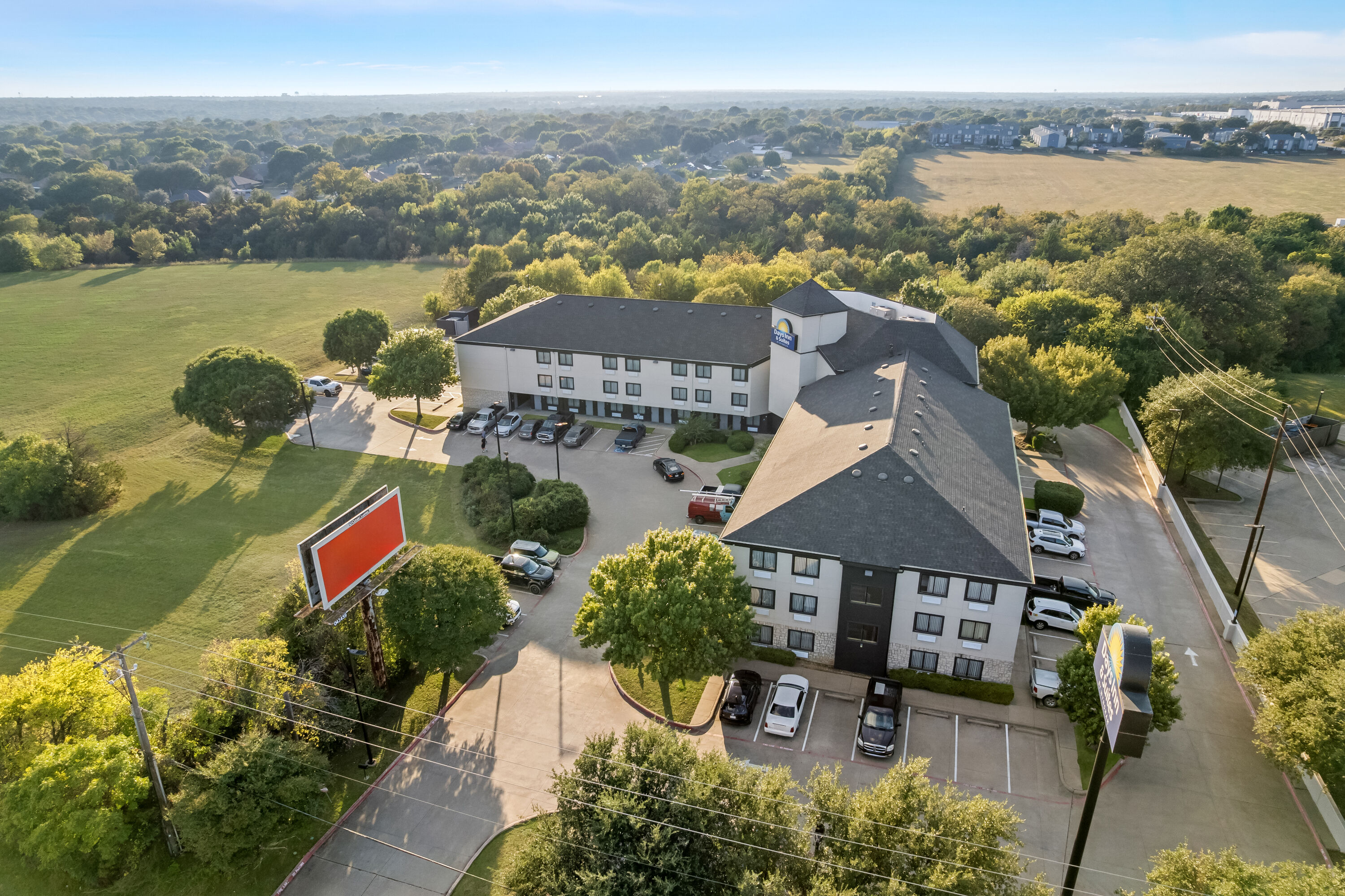 Aerial View of Days Inn & Suites by Wyndham DeSoto hotel in DeSoto, Texas
