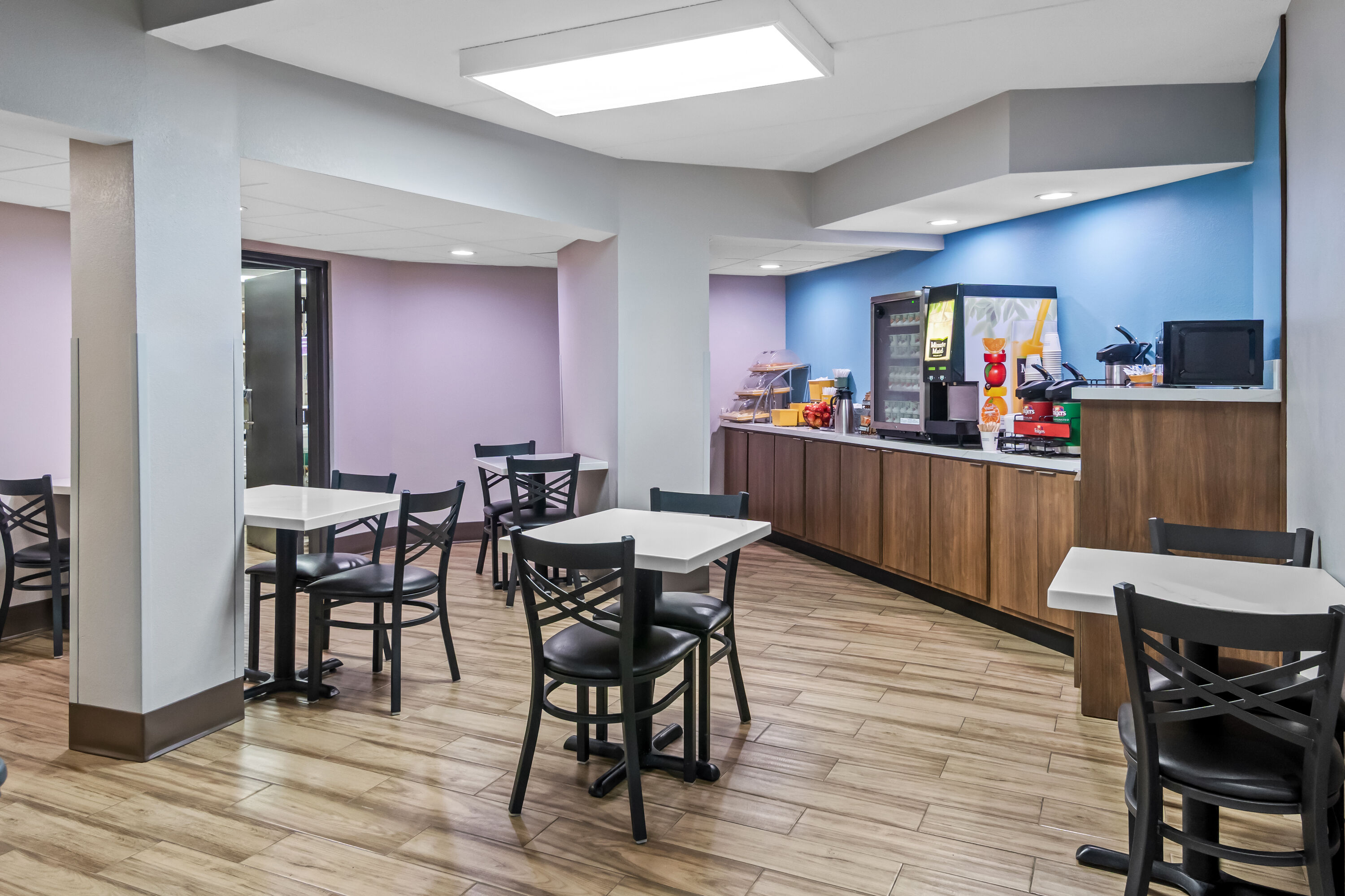 Days Inn & Suites by Wyndham DeSoto restaurant breakfast area with seating in DeSoto, Texas