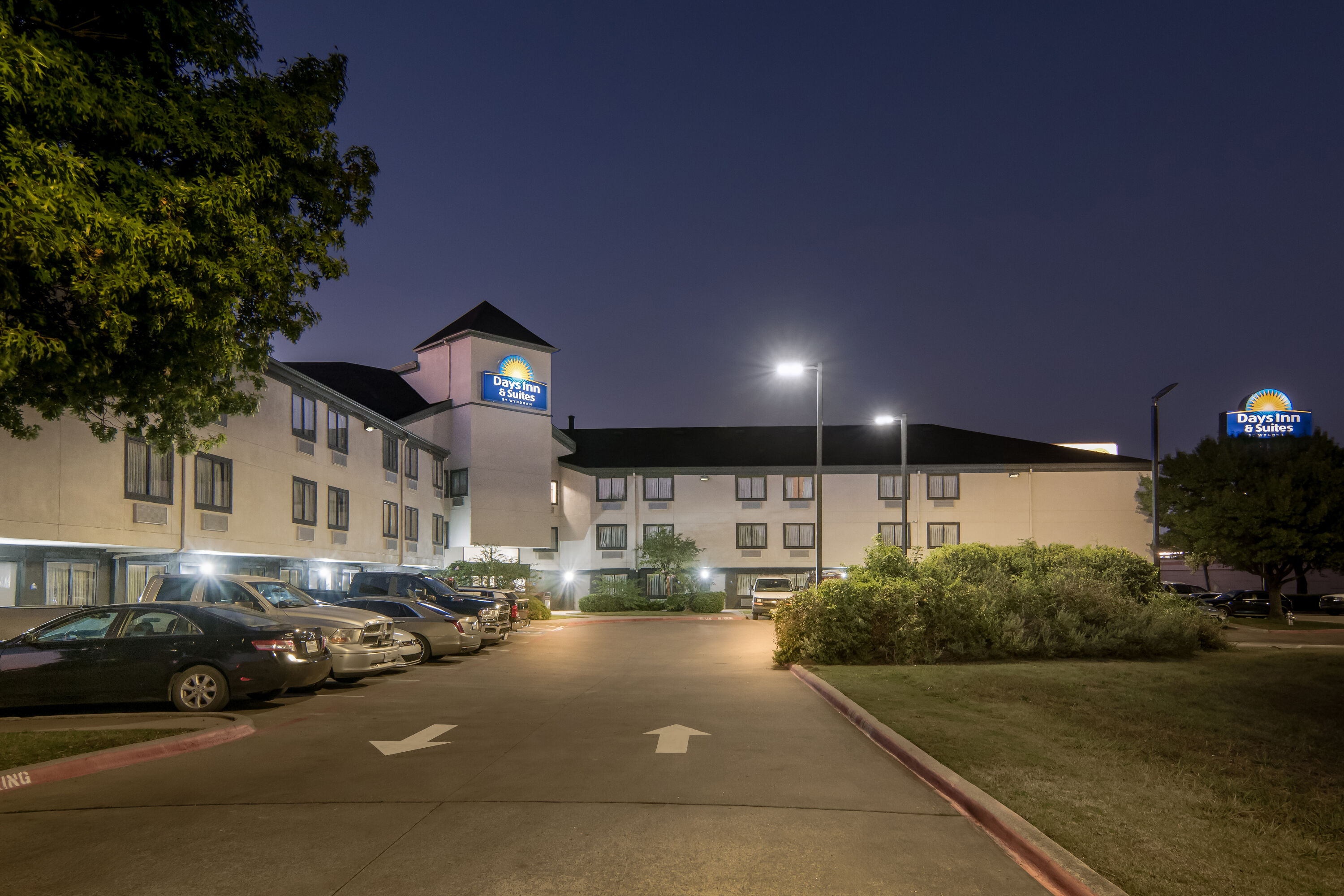 Exterior Night Image of Days Inn & Suites by Wyndham DeSoto hotel in DeSoto, Texas