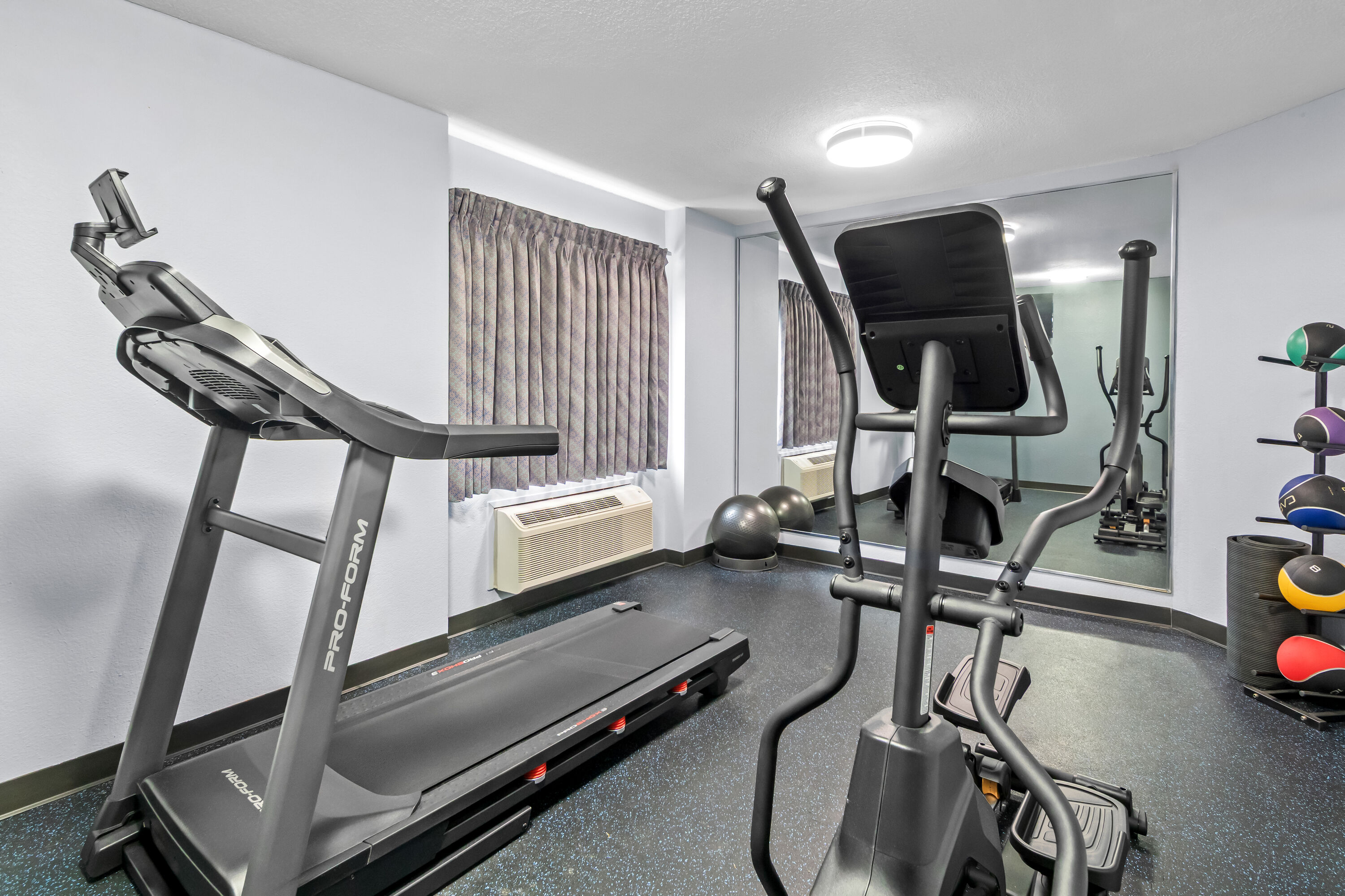 Fitness room at Days Inn & Suites by Wyndham DeSoto in DeSoto, Texas