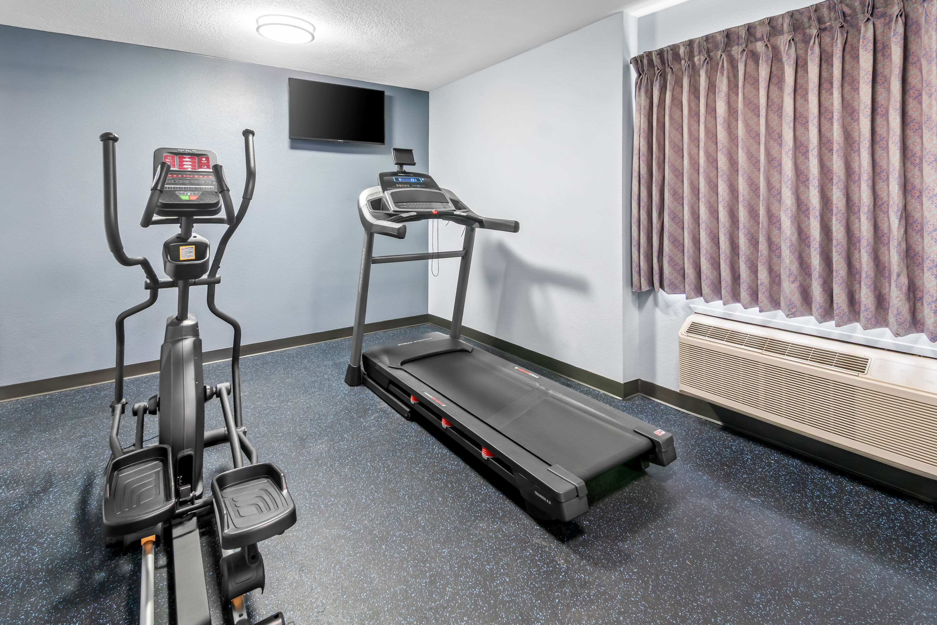Fitness room at Days Inn & Suites by Wyndham DeSoto in DeSoto, Texas