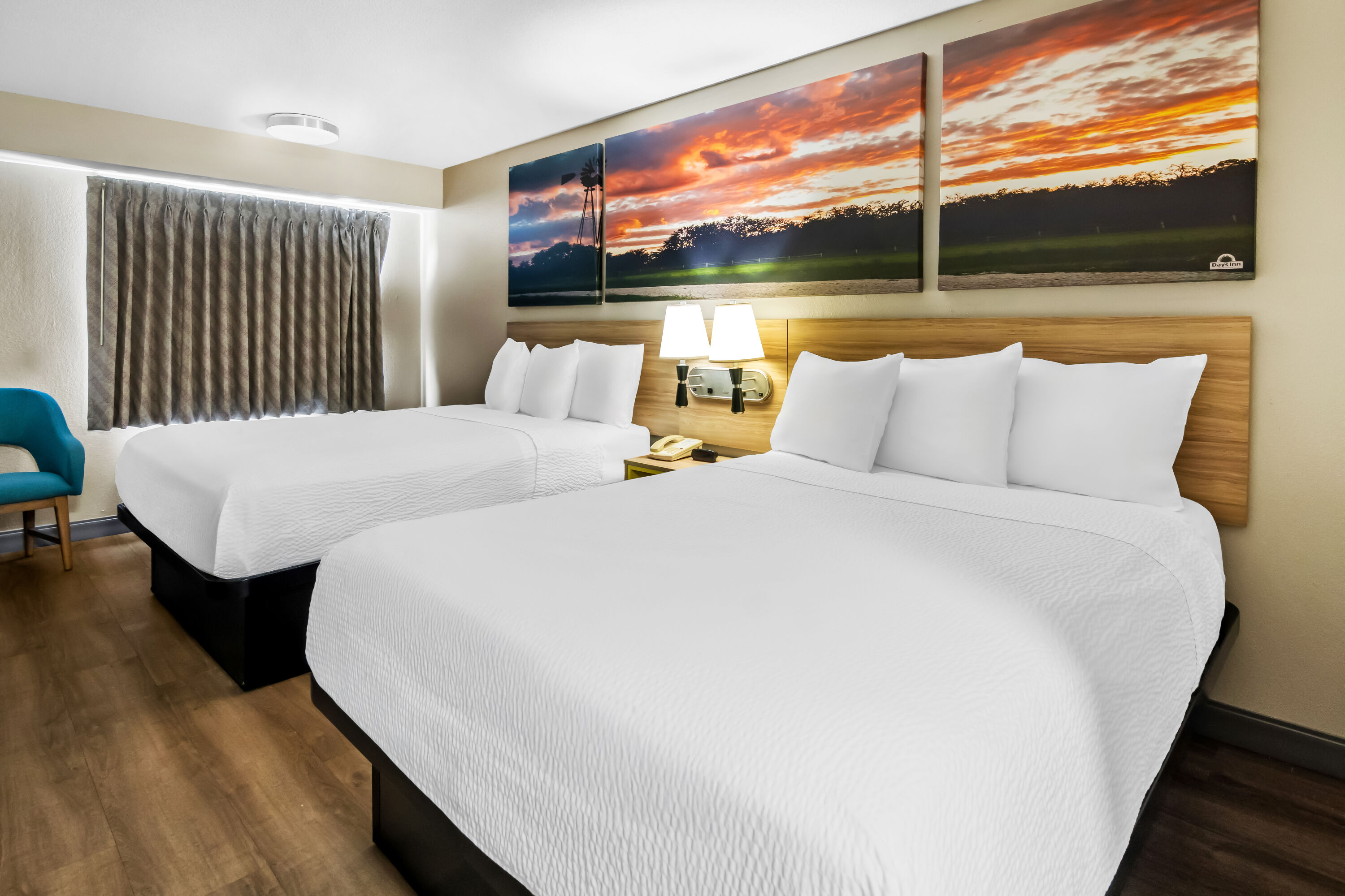 Double bed guest room at the Days Inn & Suites by Wyndham DeSoto in DeSoto, Texas