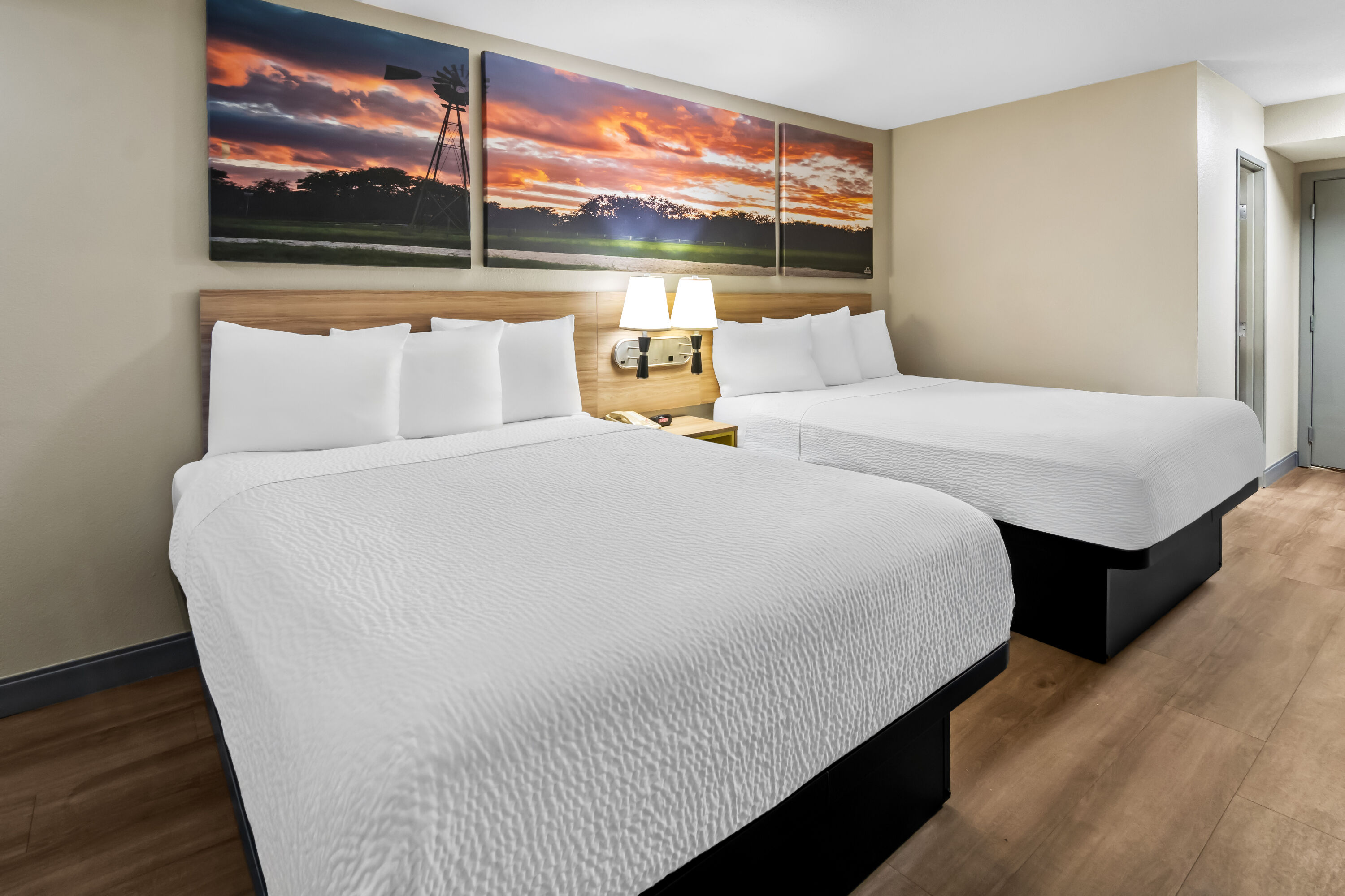 Double bed guest room at the Days Inn & Suites by Wyndham DeSoto in DeSoto, Texas