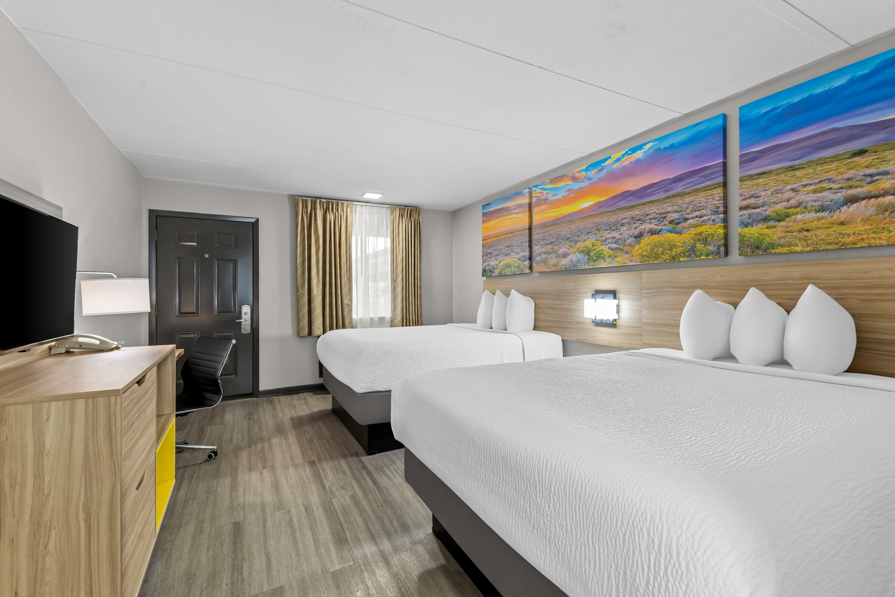 Double bed guest room at the Days Inn by Wyndham Gainesville in Gainesville, Texas