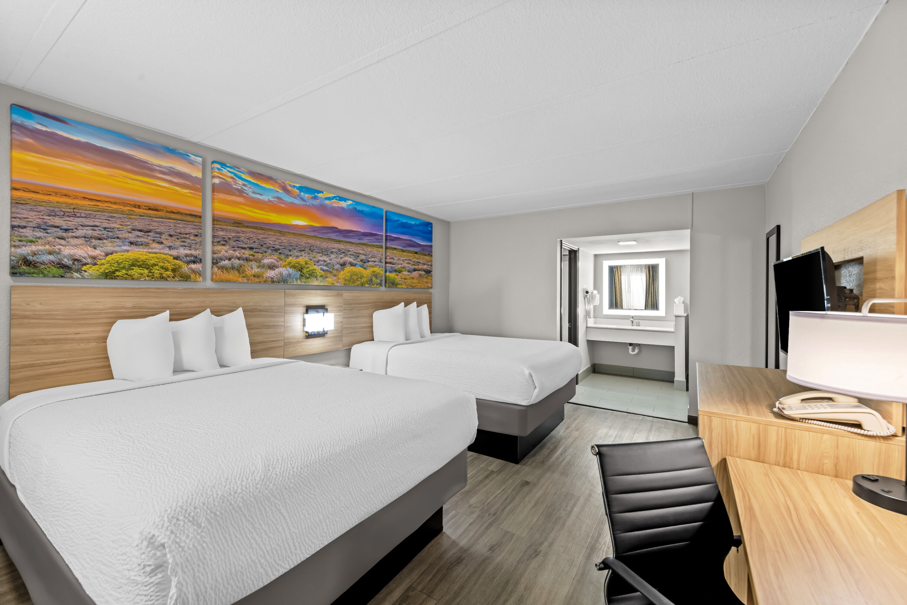 Double bed guest room at the Days Inn by Wyndham Gainesville in Gainesville, Texas