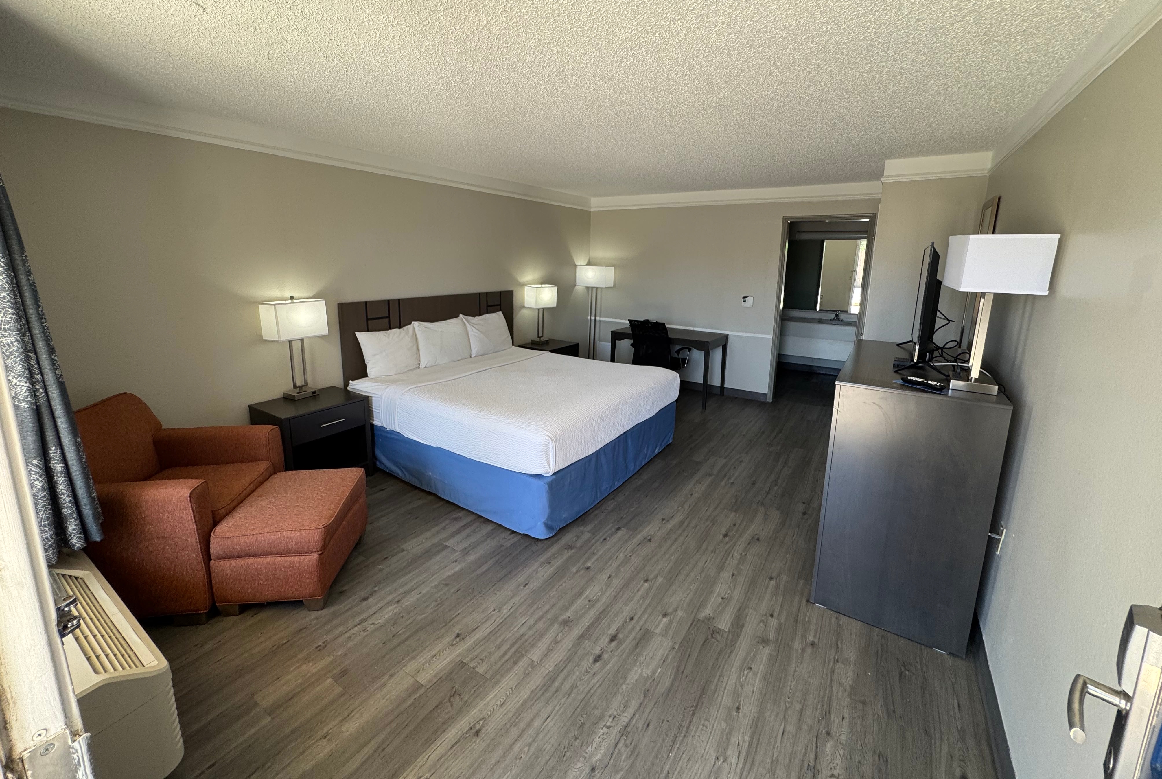 King bed guest room at the Days Inn by Wyndham Georgetown in Georgetown, Texas