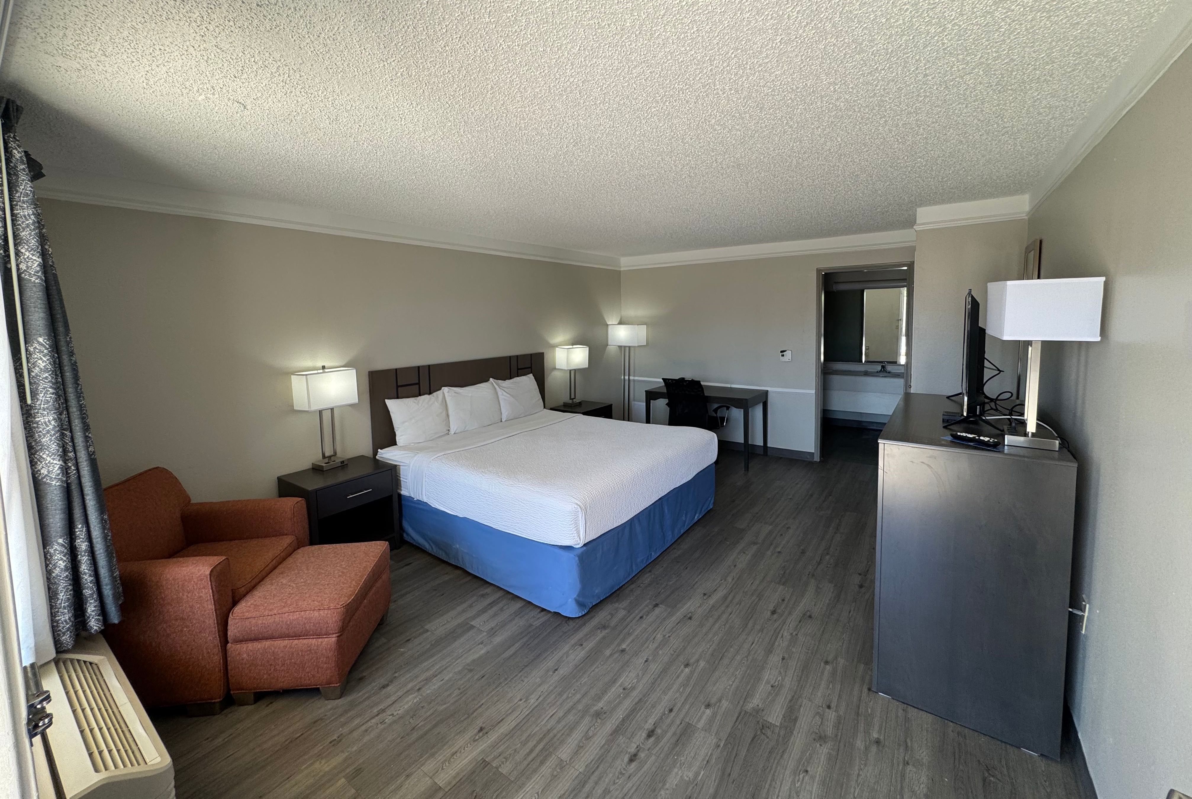 King bed guest room at the Days Inn by Wyndham Georgetown in Georgetown, Texas