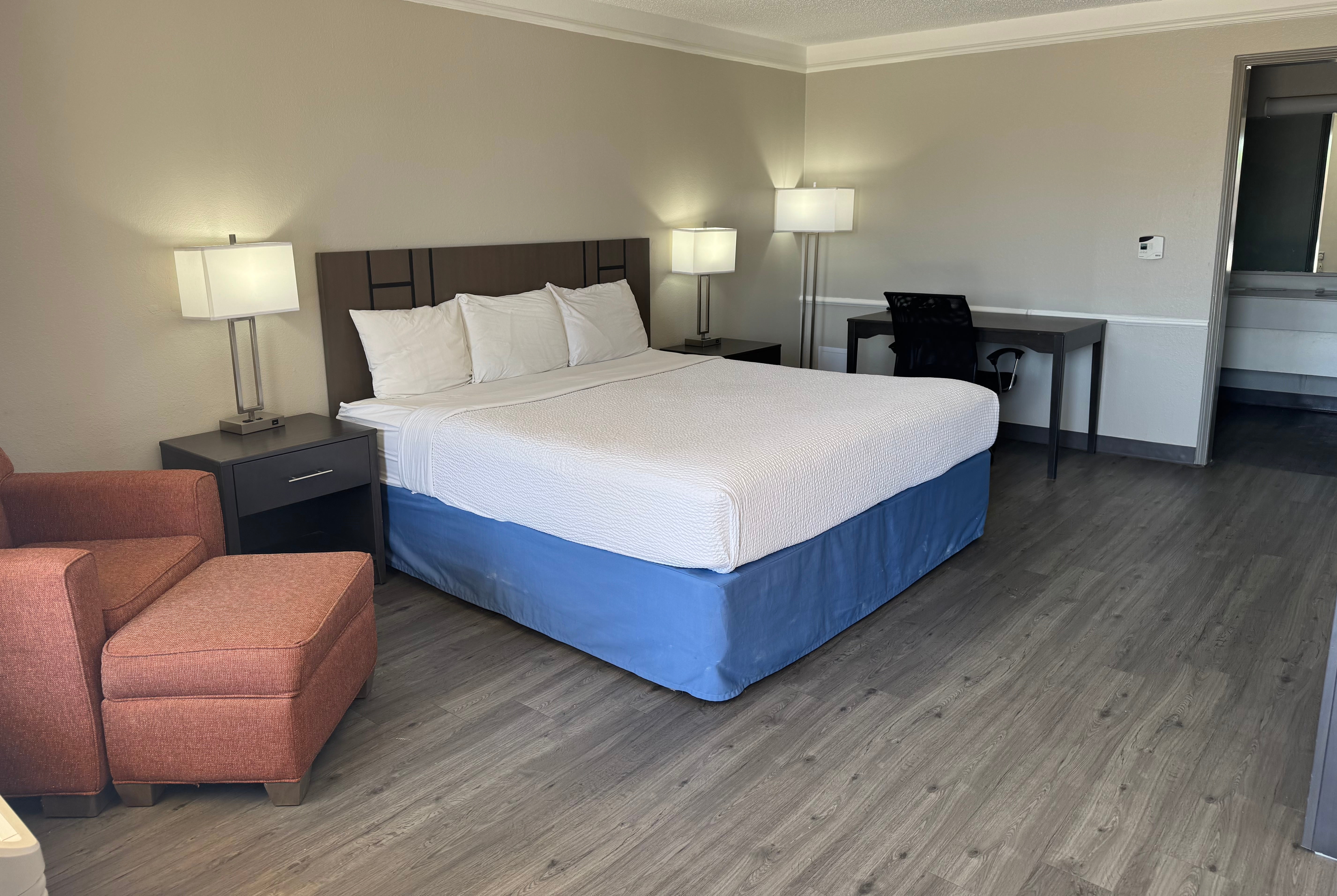 King bed guest room at the Days Inn by Wyndham Georgetown in Georgetown, Texas