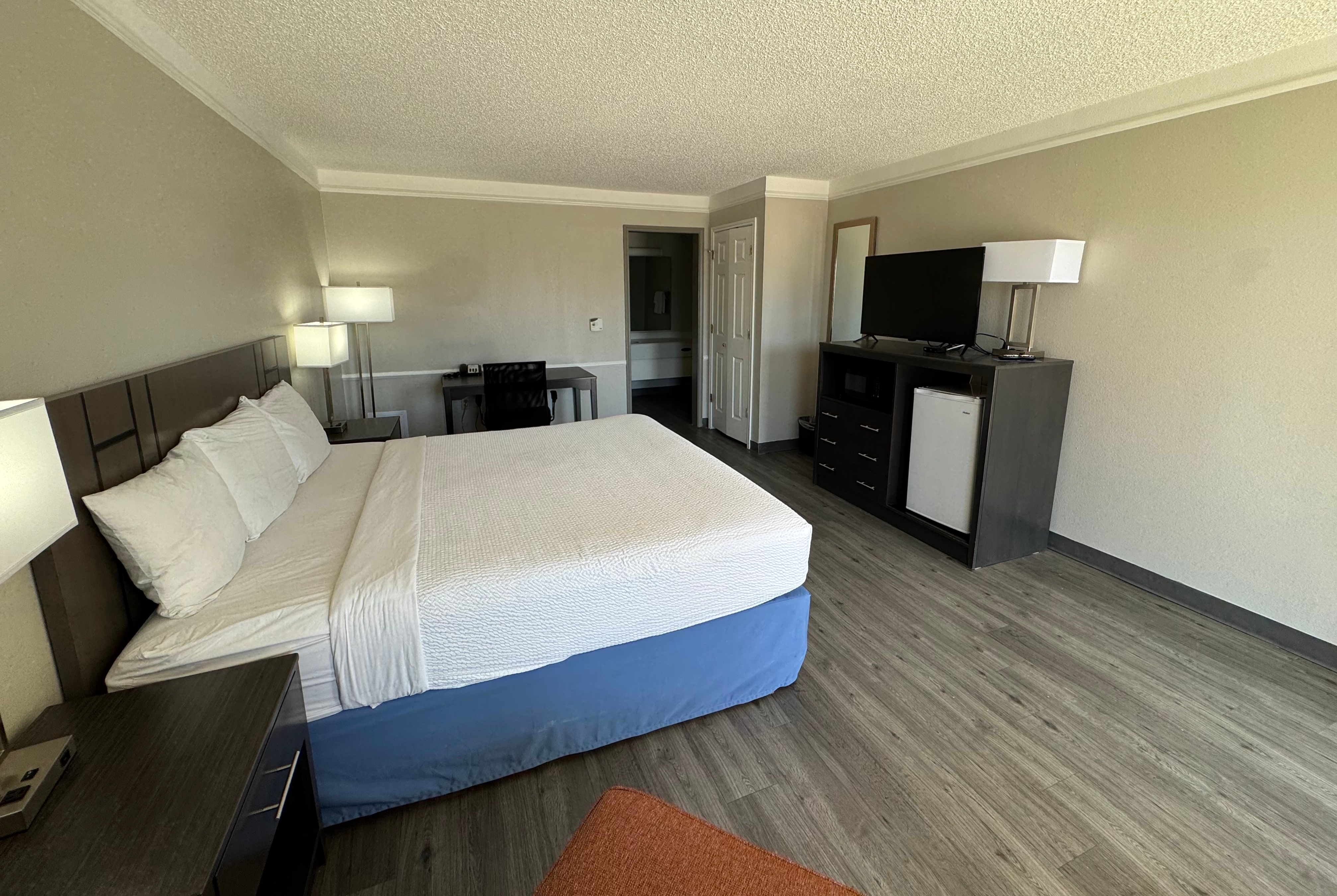 King bed guest room at the Days Inn by Wyndham Georgetown in Georgetown, Texas