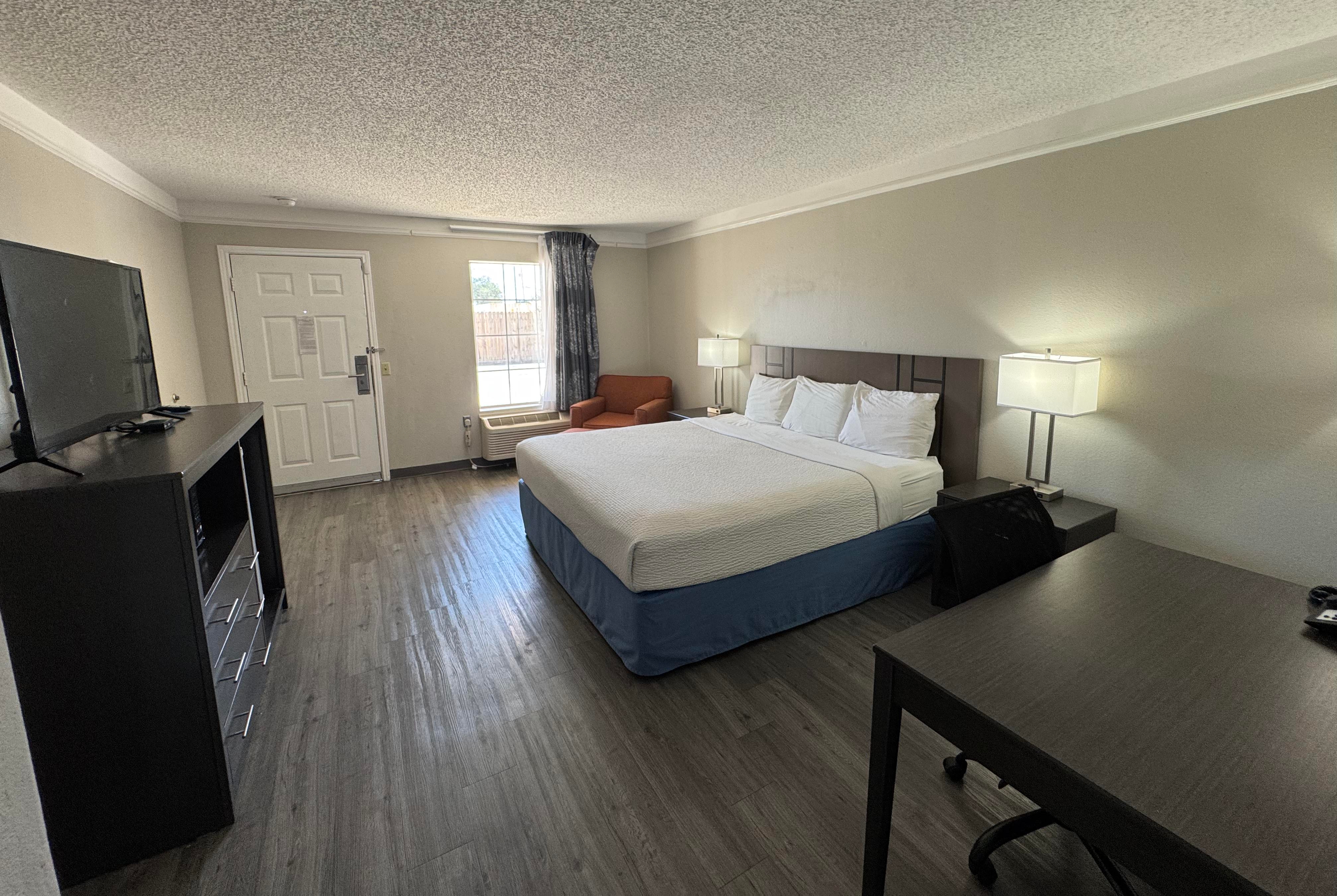 King bed guest room at the Days Inn by Wyndham Georgetown in Georgetown, Texas