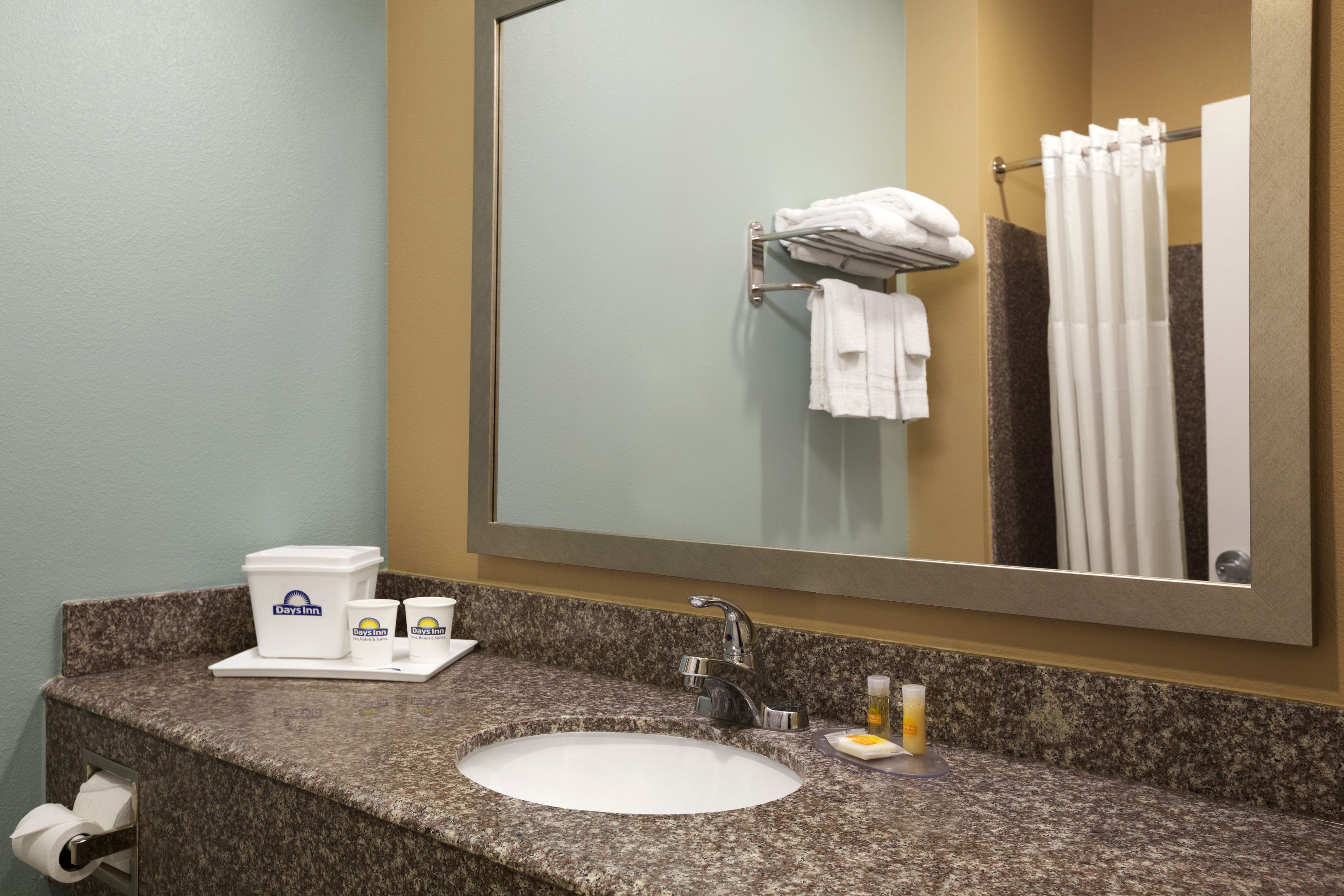 Guest room bath at the Days Inn & Suites by Wyndham Gonzales TX in Gonzales, Texas