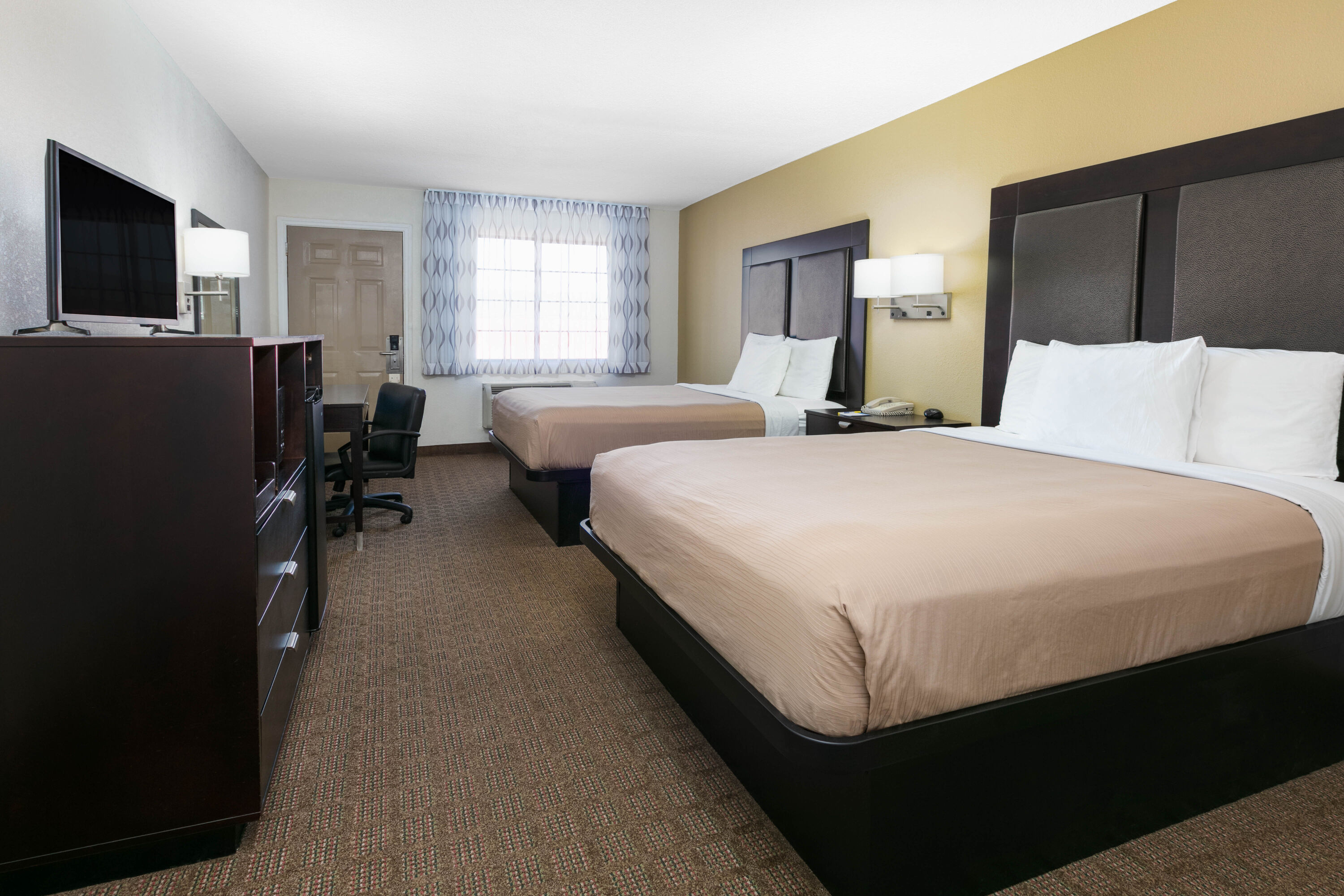 Guest room at the Days Inn by Wyndham Granbury in Granbury, Texas