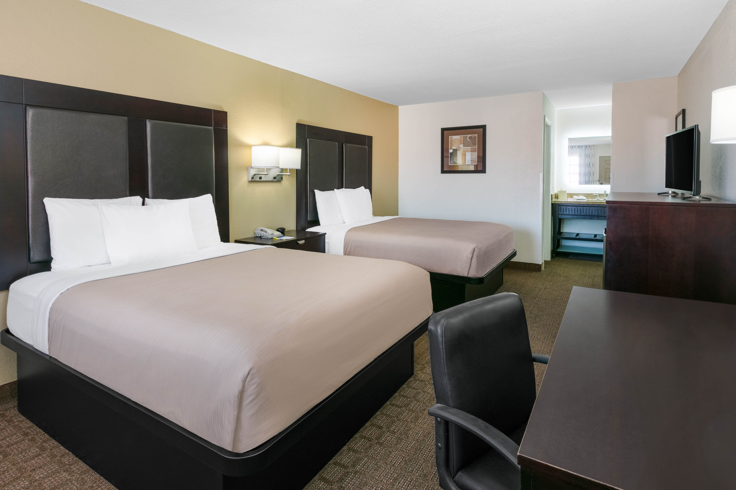 Guest room at the Days Inn by Wyndham Granbury in Granbury, Texas