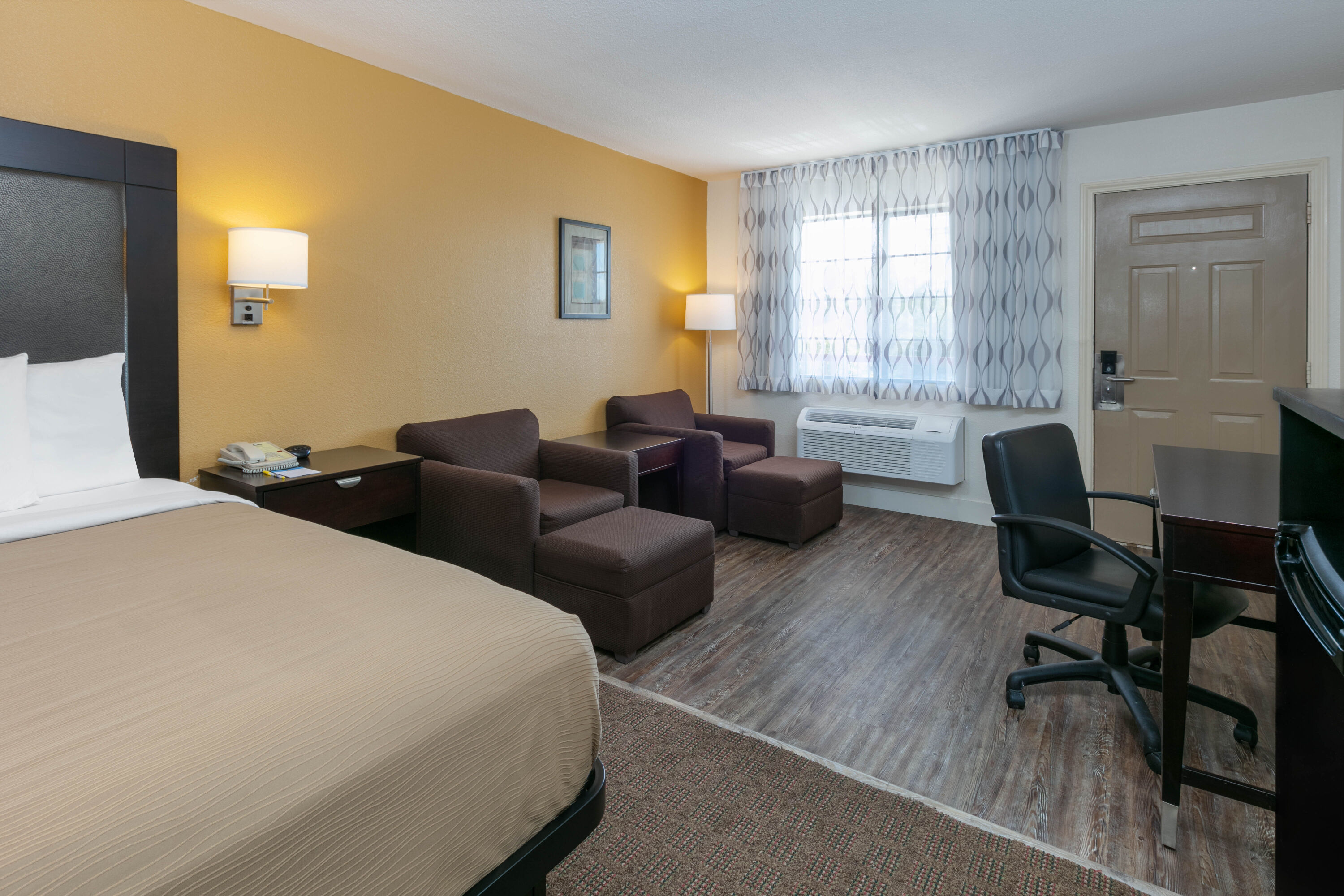 Guest room at the Days Inn by Wyndham Granbury in Granbury, Texas