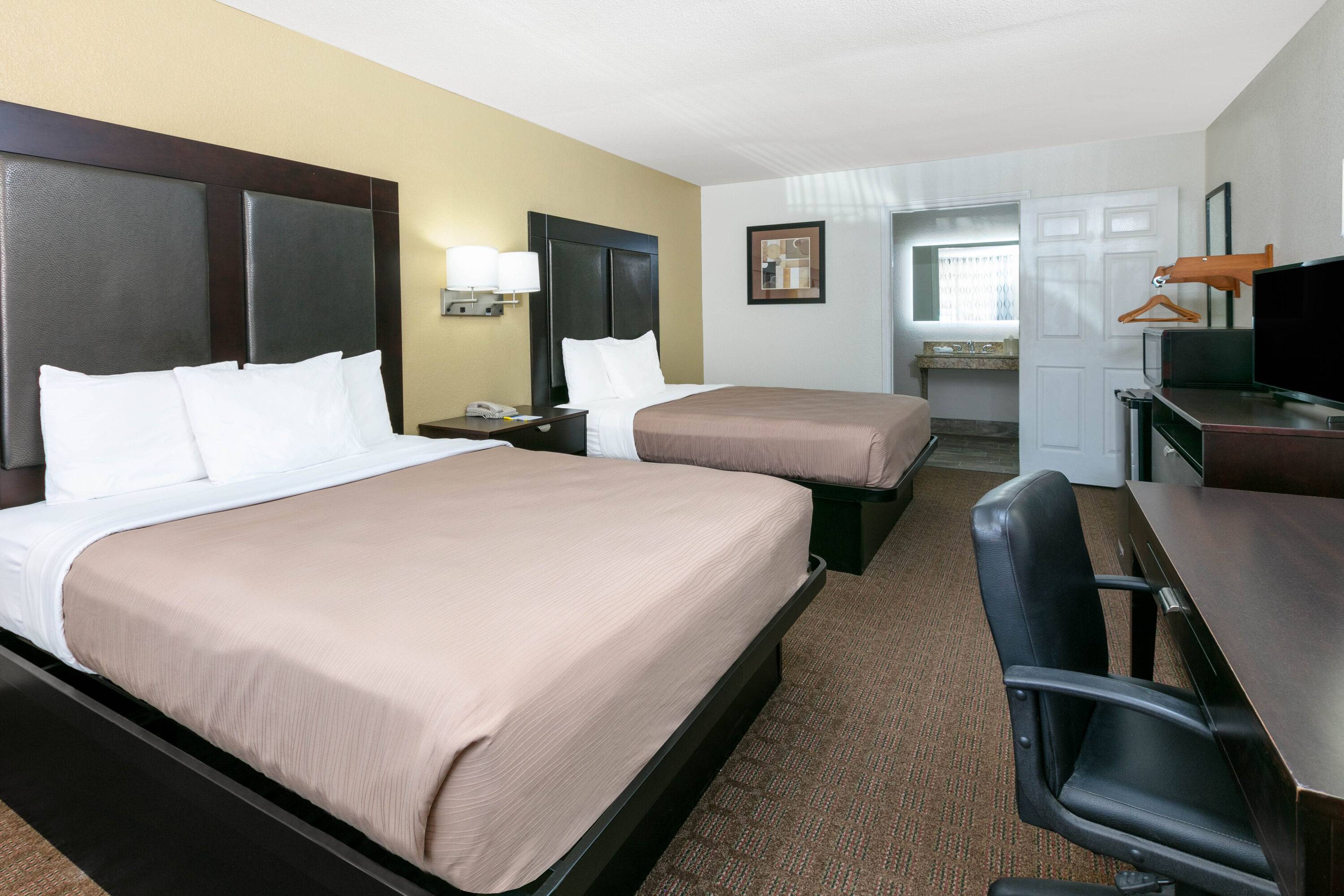 Guest room at the Days Inn by Wyndham Granbury in Granbury, Texas