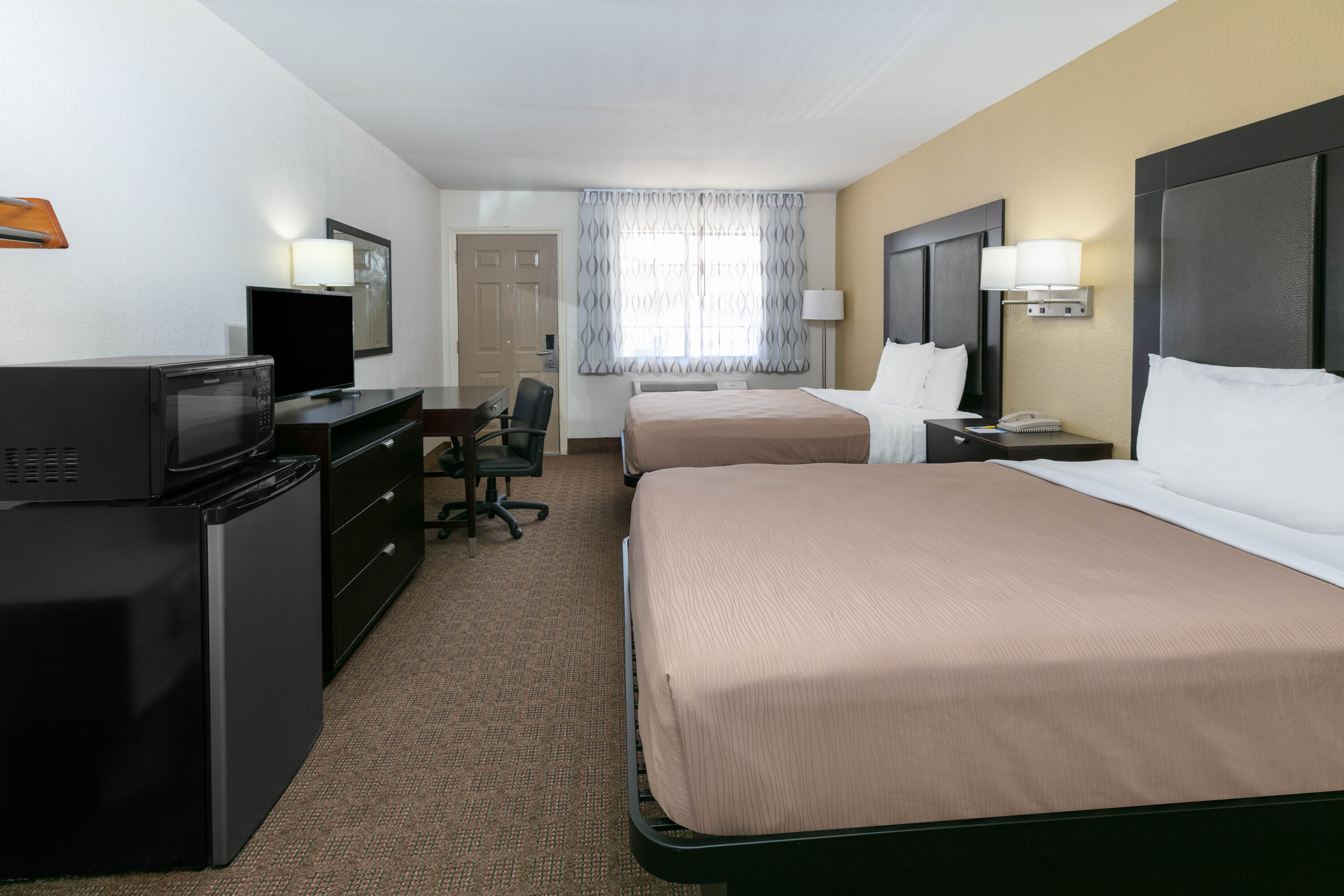 Guest room at the Days Inn by Wyndham Granbury in Granbury, Texas