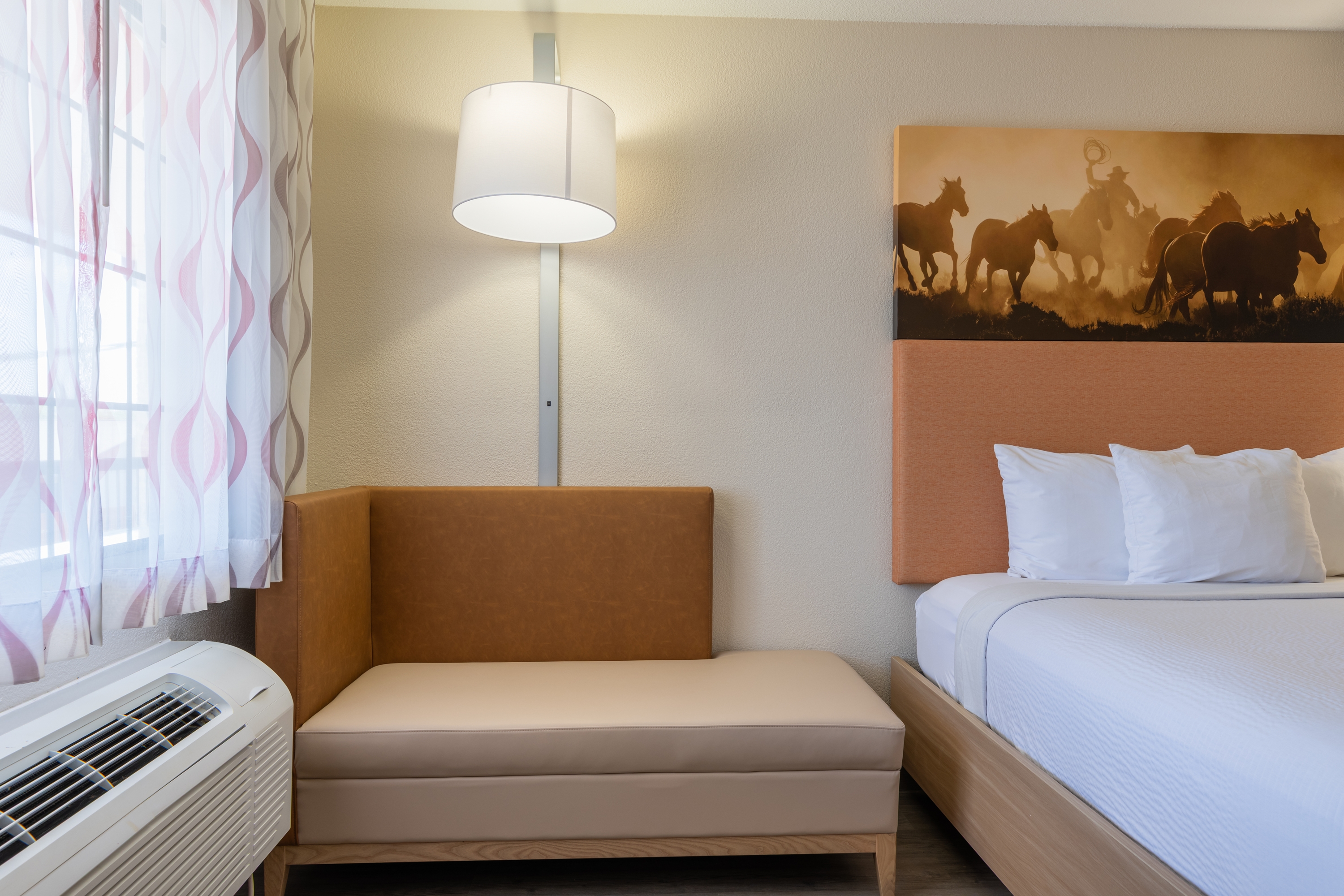 Guest room at the Days Inn by Wyndham Granbury in Granbury, Texas