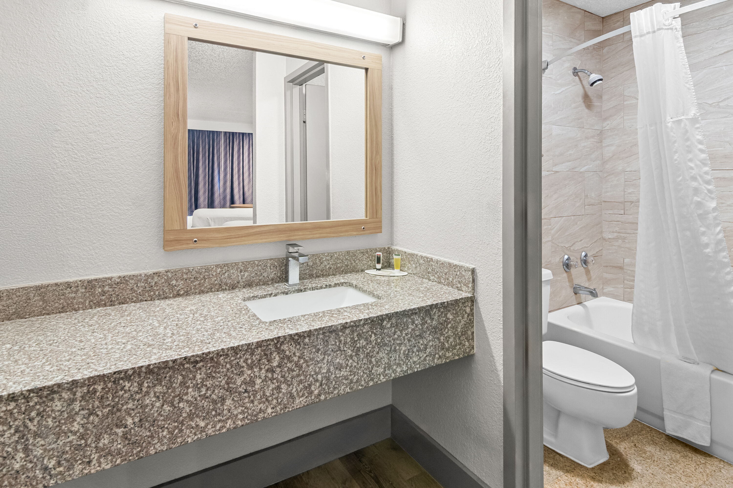 Guest room bath at the Days Inn by Wyndham Hillsboro TX in Hillsboro, Texas