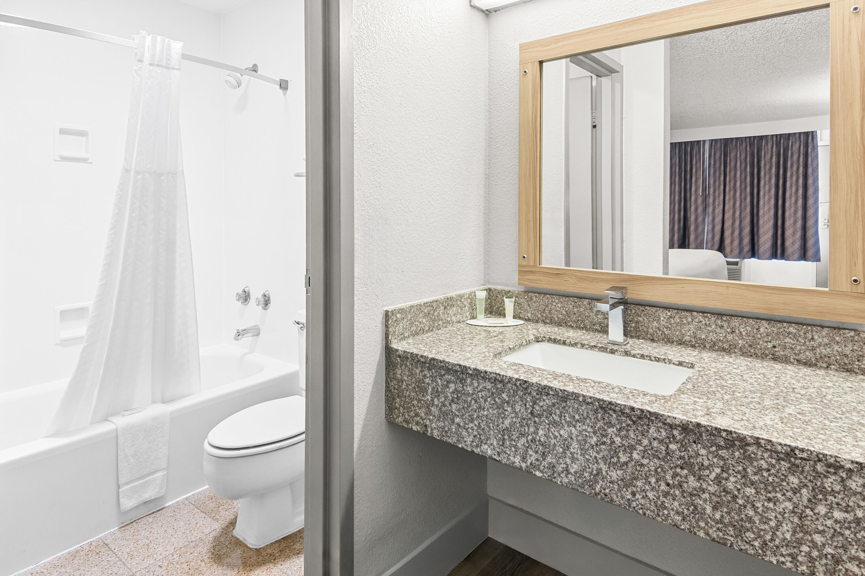 Guest room bath at the Days Inn by Wyndham Hillsboro TX in Hillsboro, Texas