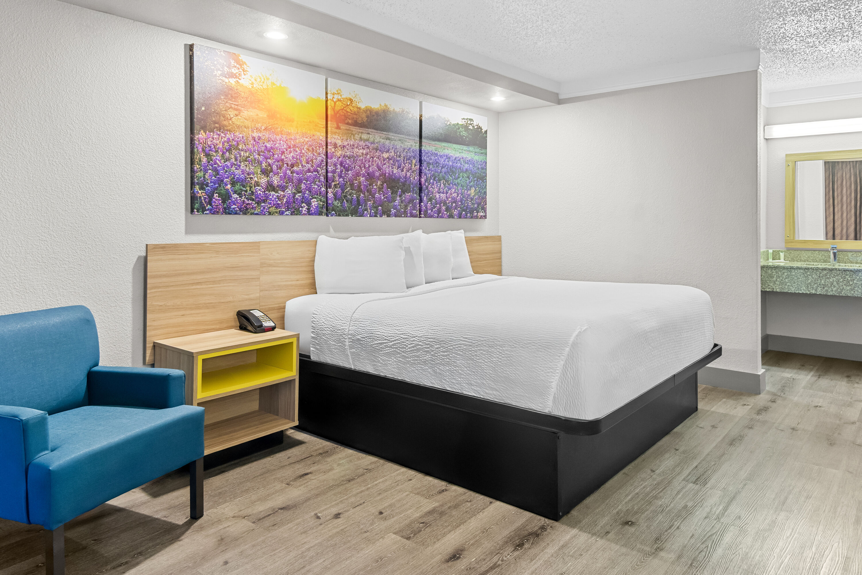 King bed guest room at the Days Inn by Wyndham Hillsboro TX in Hillsboro, Texas