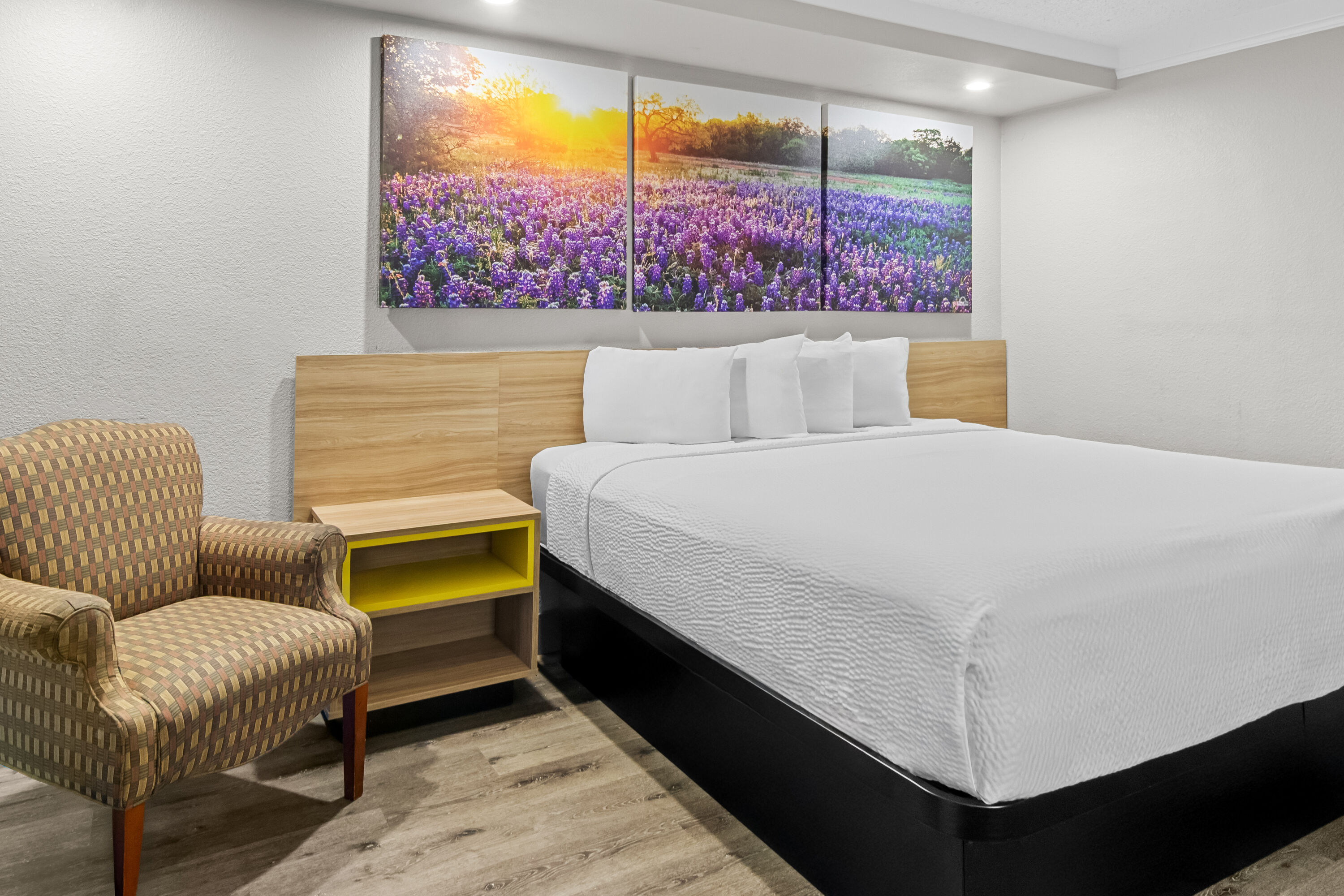 King bed guest room at the Days Inn by Wyndham Hillsboro TX in Hillsboro, Texas