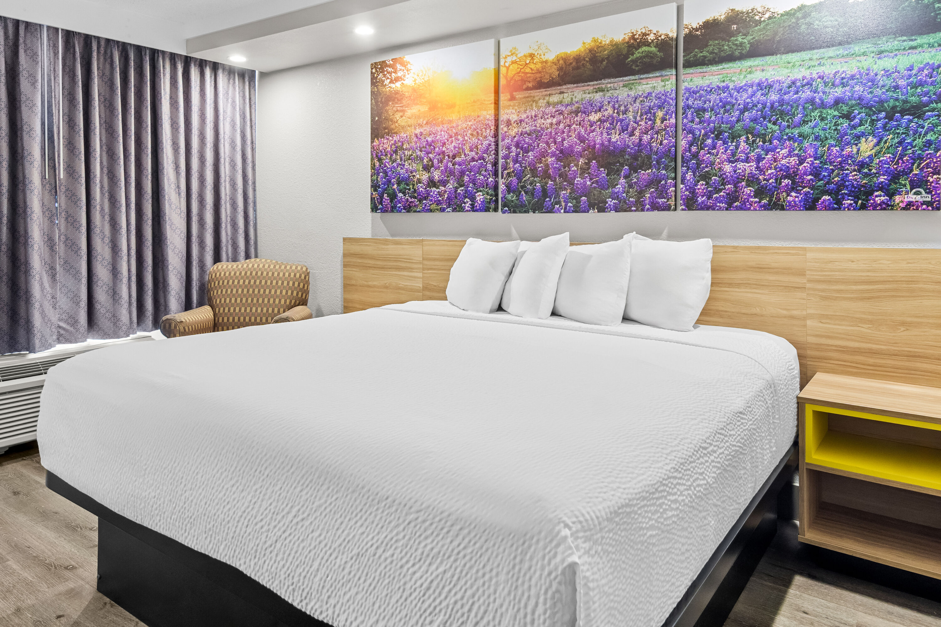 King bed guest room at the Days Inn by Wyndham Hillsboro TX in Hillsboro, Texas