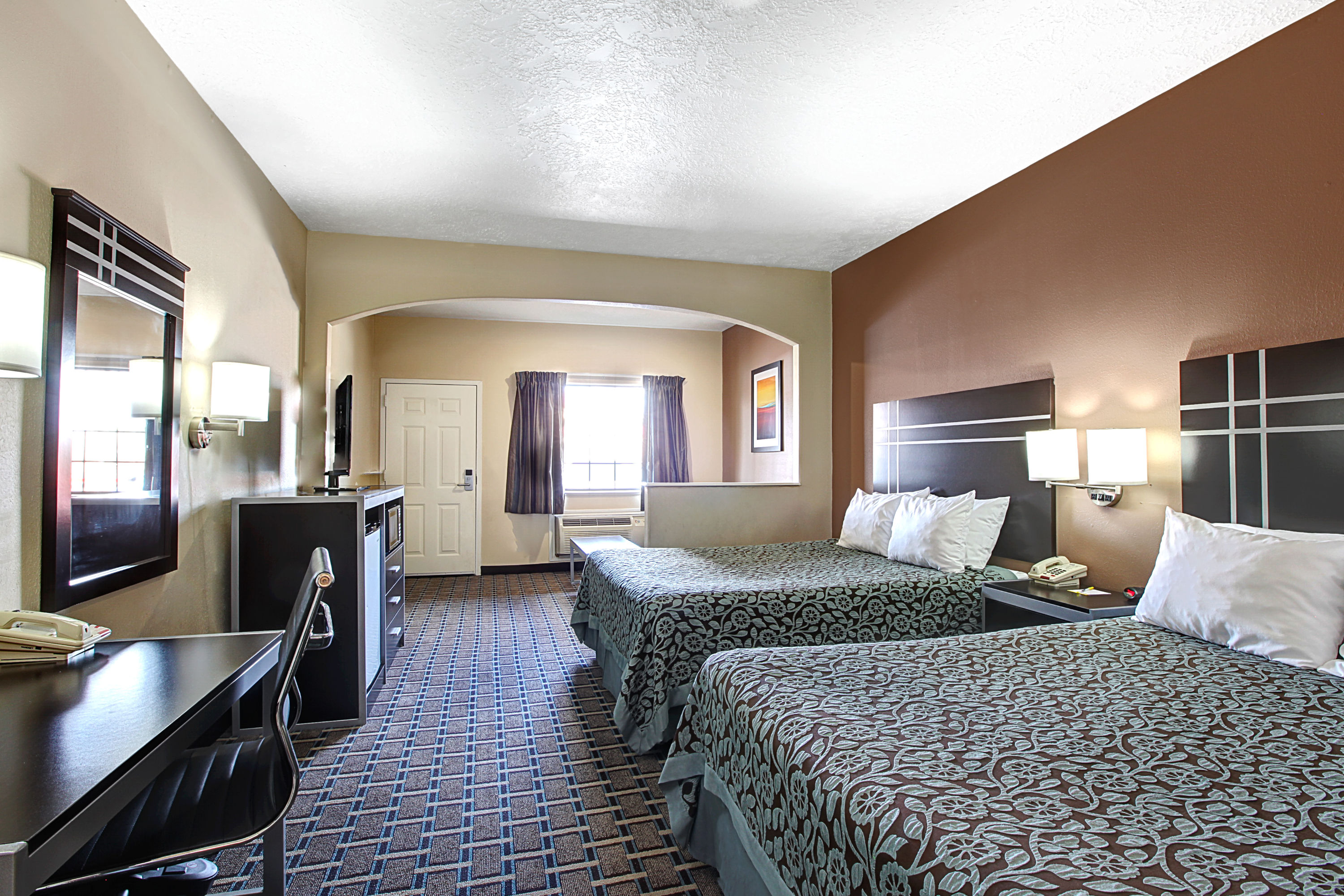 Guest room at the Days Inn & Suites by Wyndham Houston North/Spring in Houston, Texas