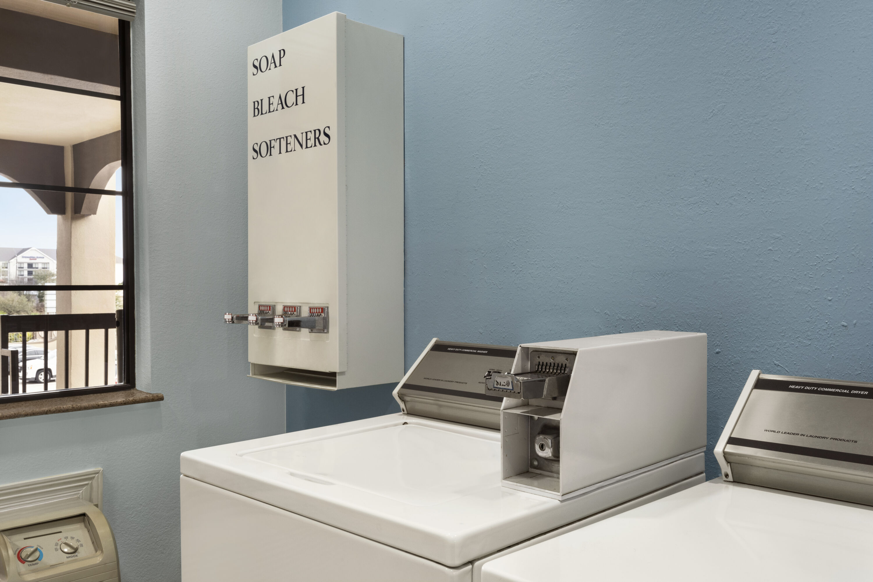 Laundry facilities at Days Inn & Suites by Wyndham Houston Hobby Airport in Houston, Texas