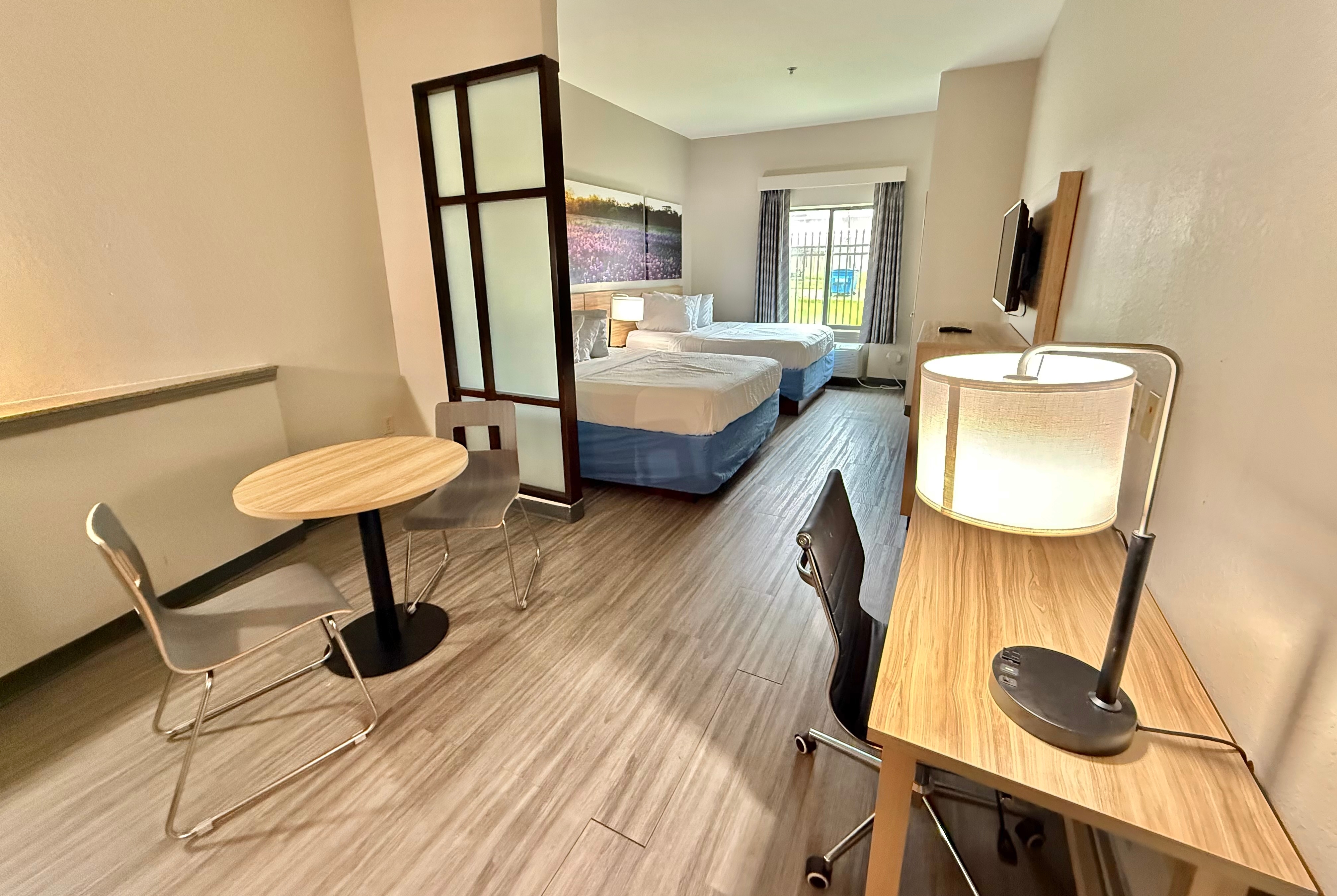 Guest room at the Days Inn & Suites by Wyndham Houston / West Energy Corridor in Houston, Texas