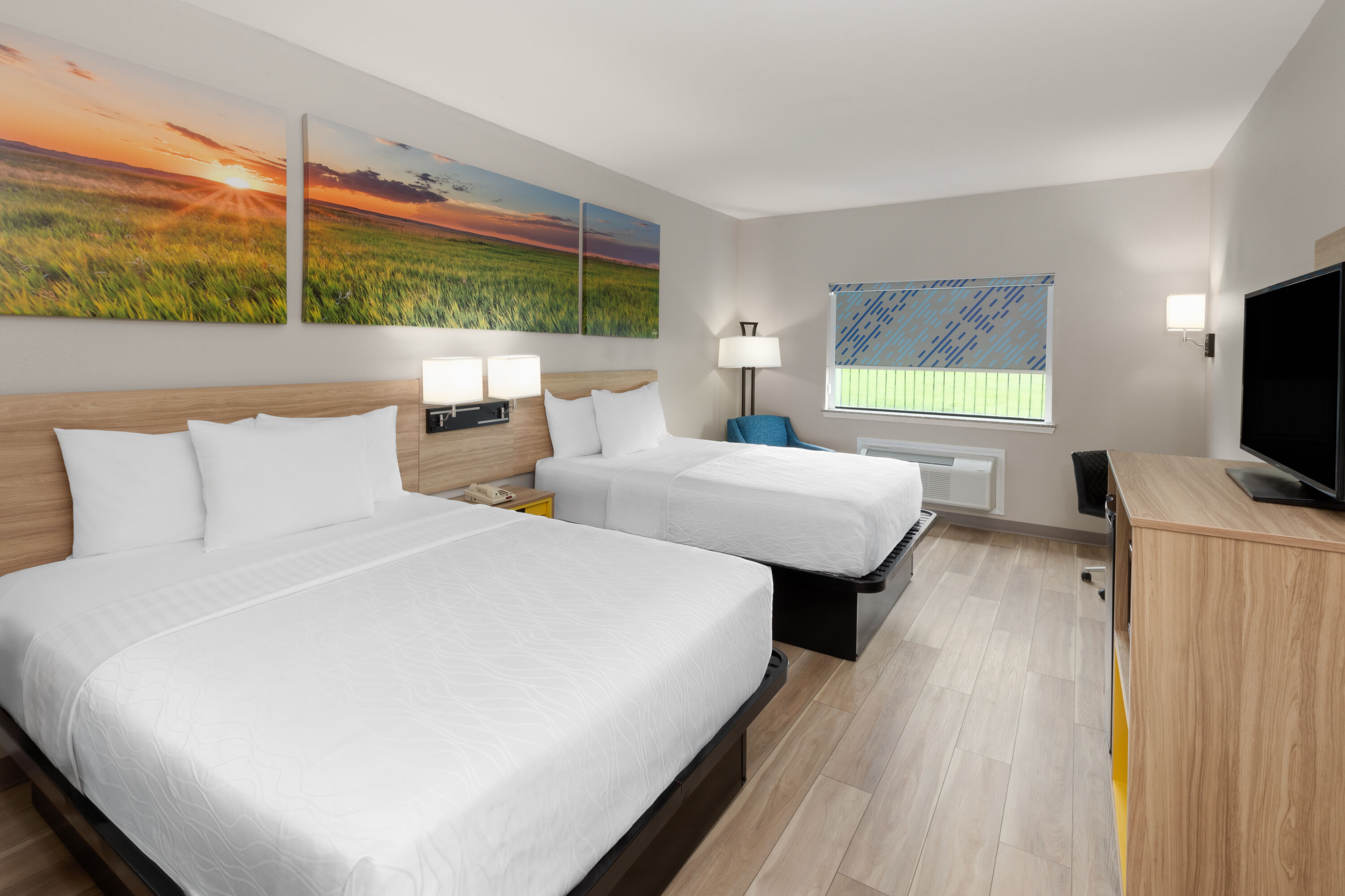 Guest room at the Days Inn & Suites by Wyndham Sam Houston Tollway in Houston, Texas