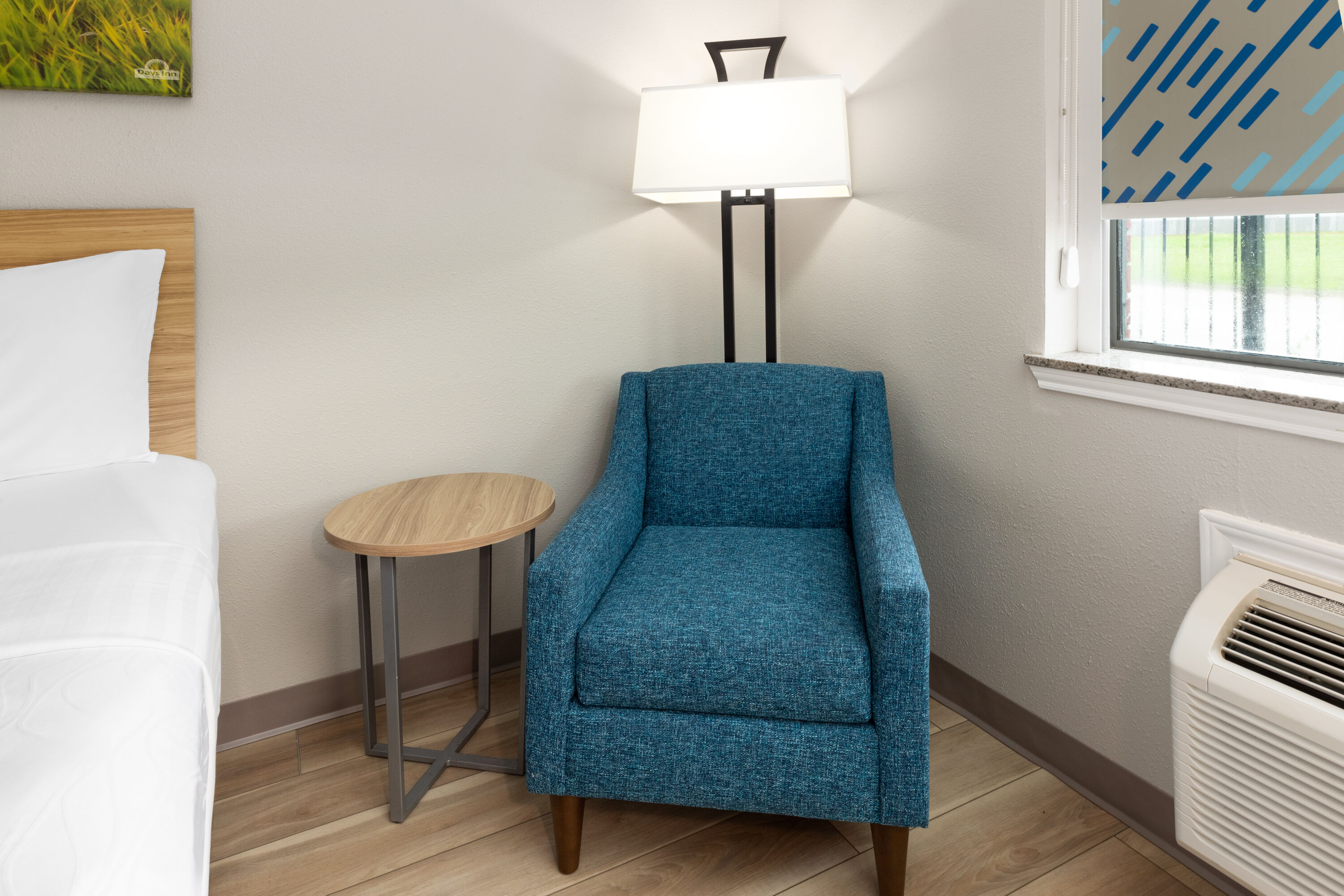 Guest room at the Days Inn & Suites by Wyndham Sam Houston Tollway in Houston, Texas