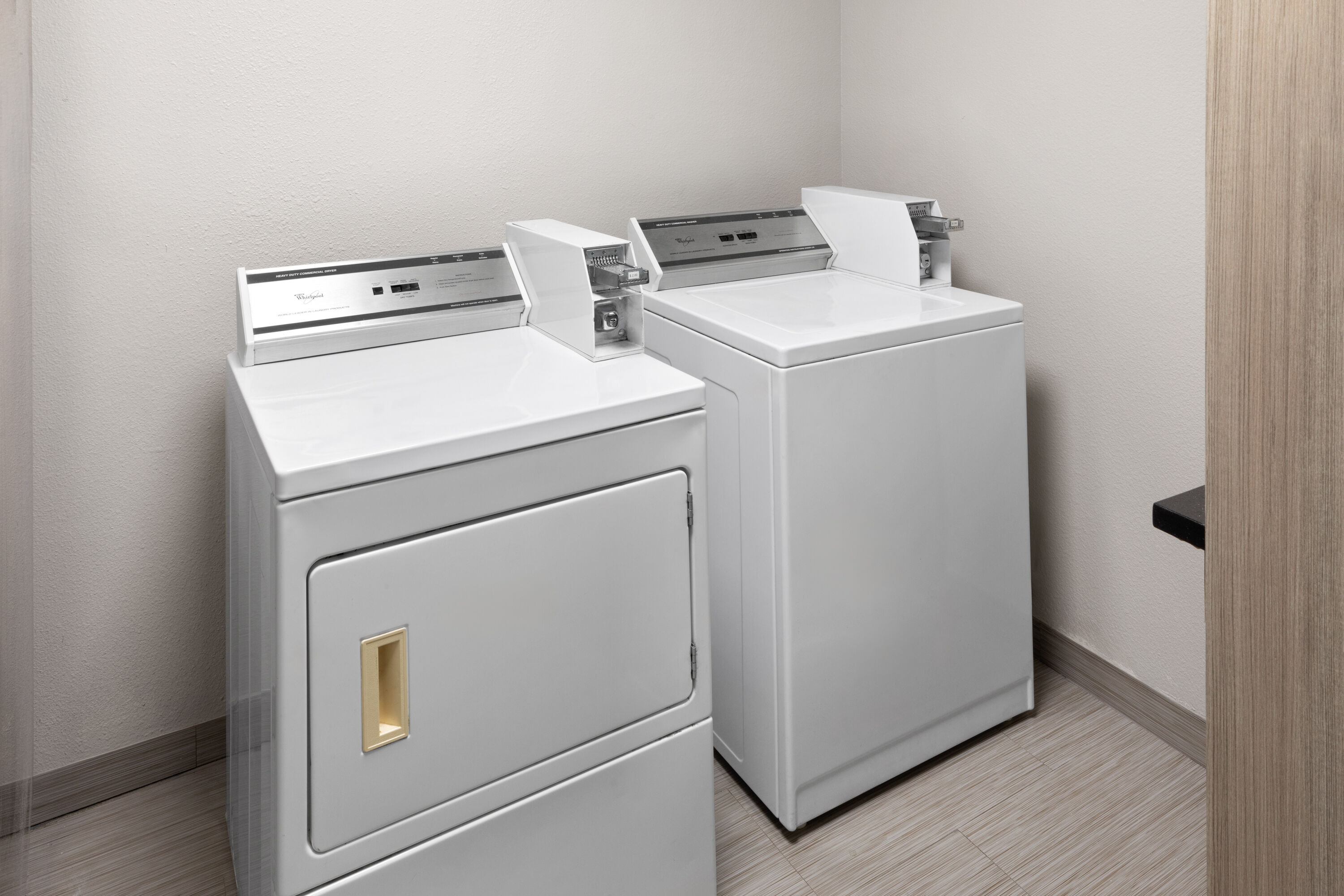 Laundry facilities at Days Inn & Suites by Wyndham Sam Houston Tollway in Houston, Texas