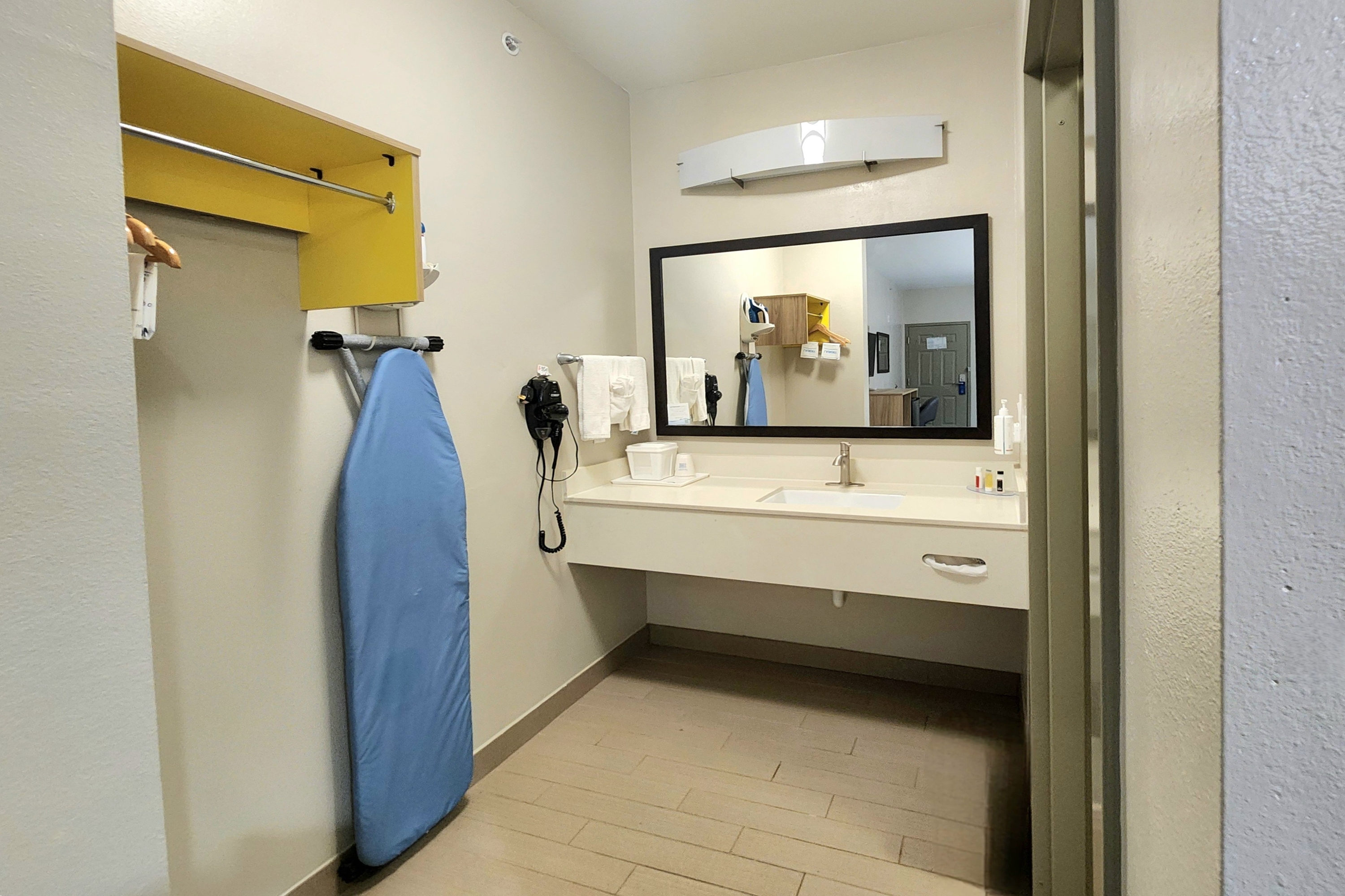 Guest room bath at the Days Inn & Suites by Wyndham Katy in Katy, Texas