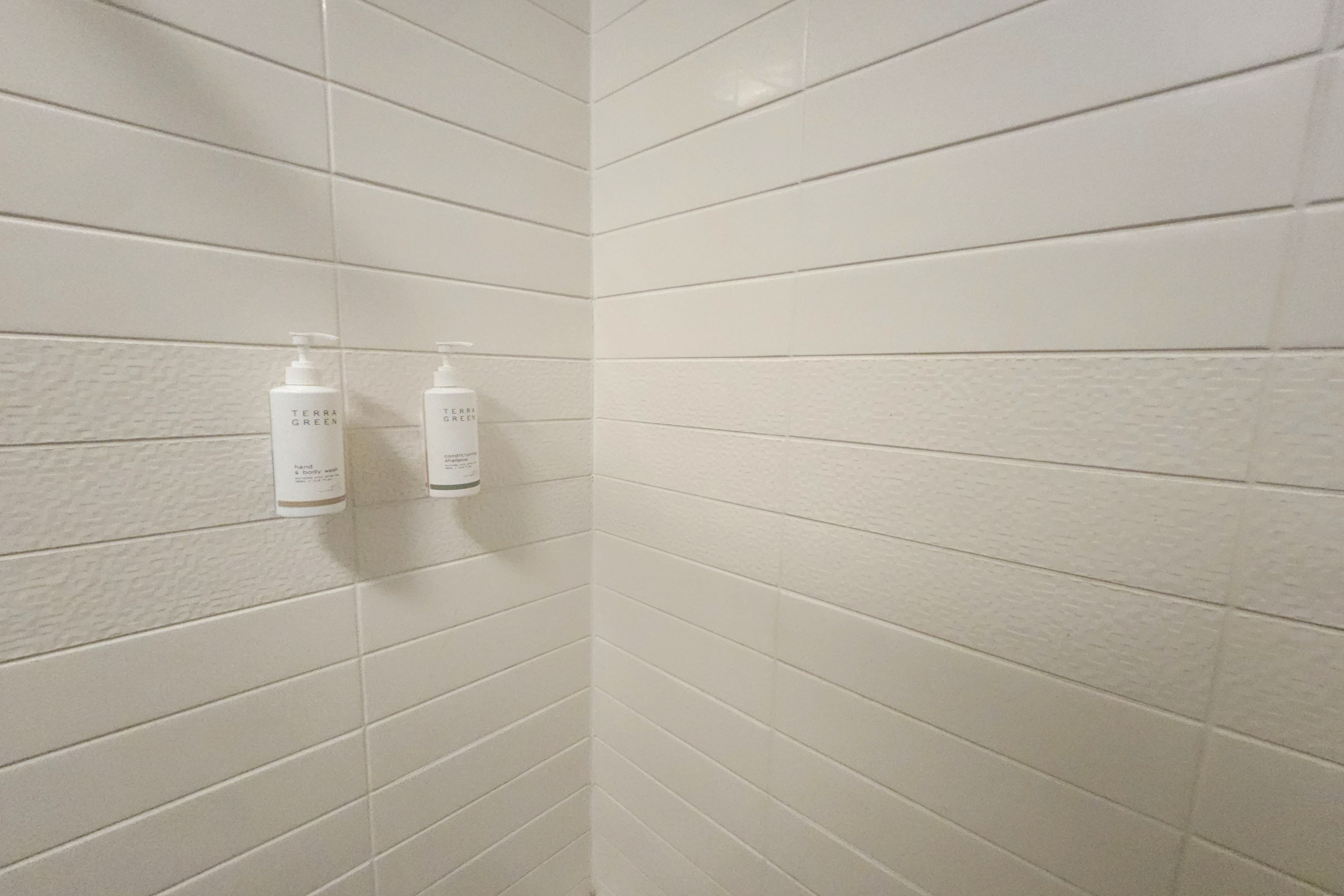 Guest room bath at the Days Inn & Suites by Wyndham Katy in Katy, Texas