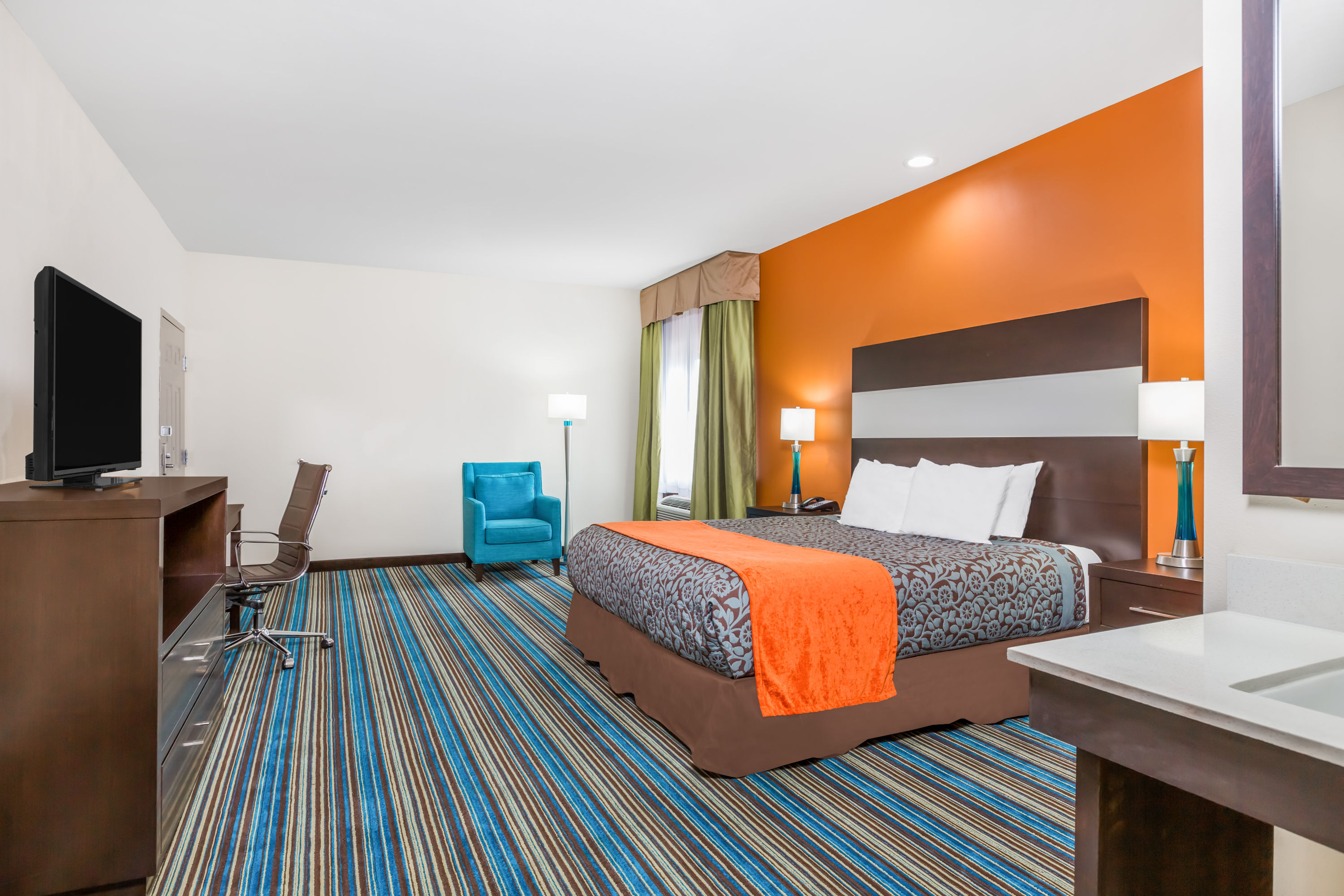 Guest room at the Days Inn & Suites by Wyndham Katy in Katy, Texas