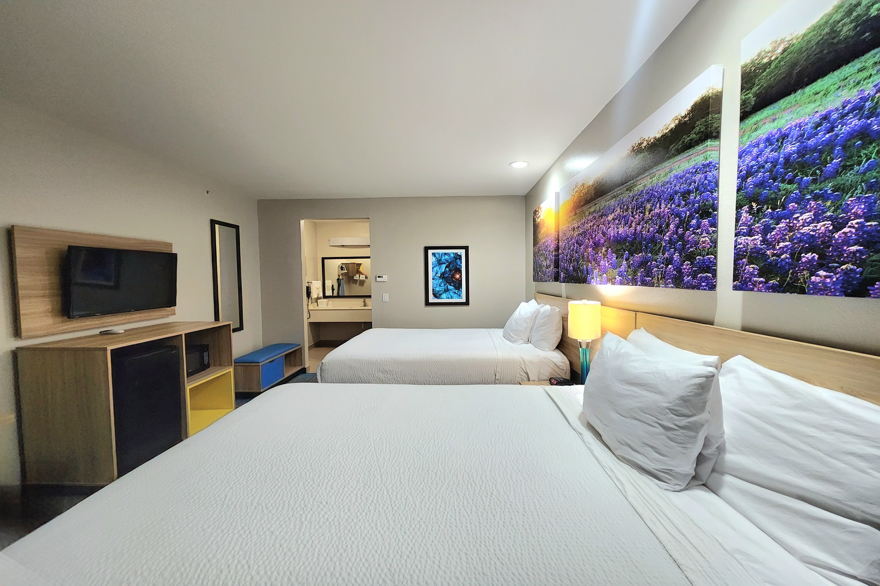 Guest room at the Days Inn & Suites by Wyndham Katy in Katy, Texas