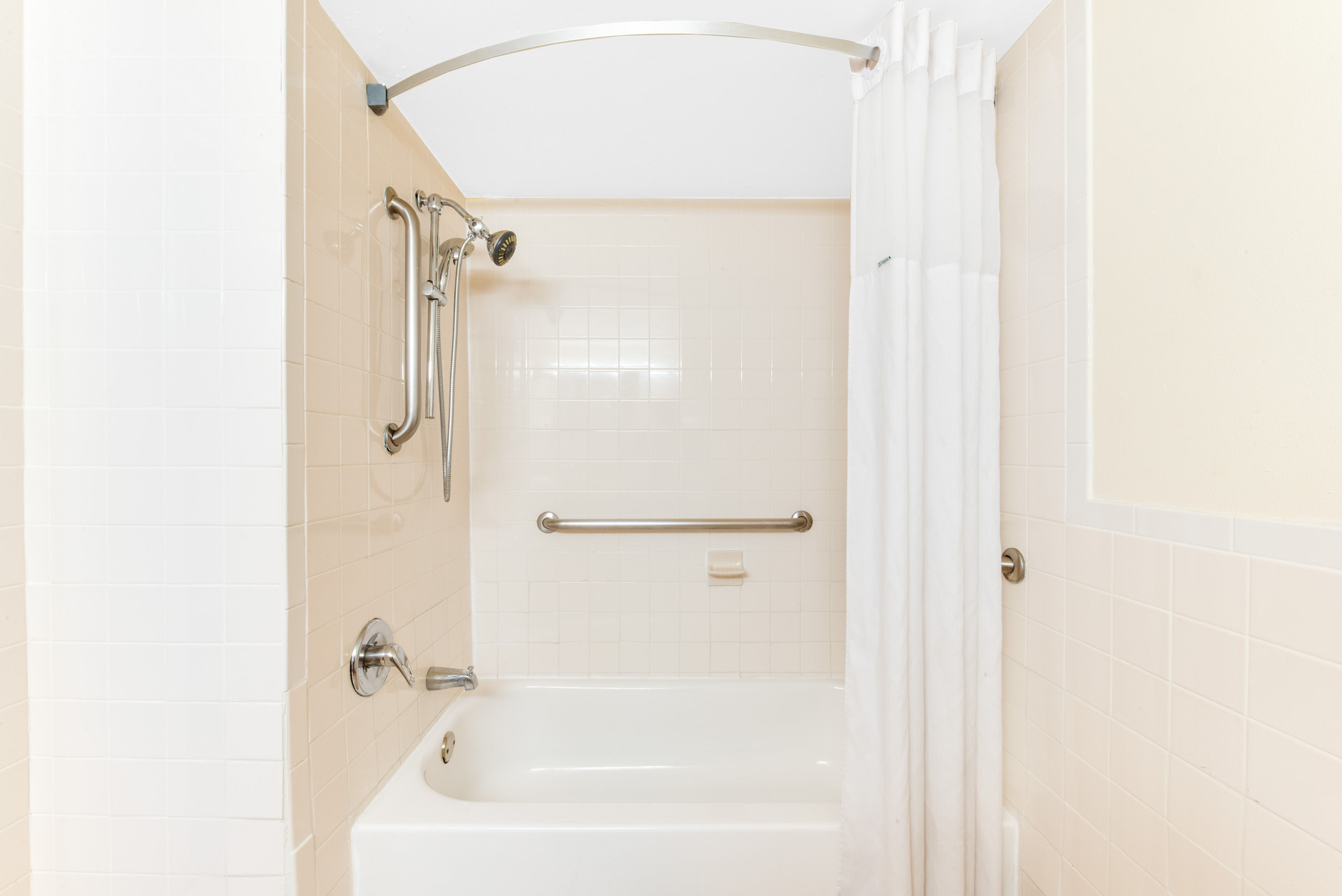 Guest room bath at the Days Inn & Suites by Wyndham Laredo in Laredo, Texas
