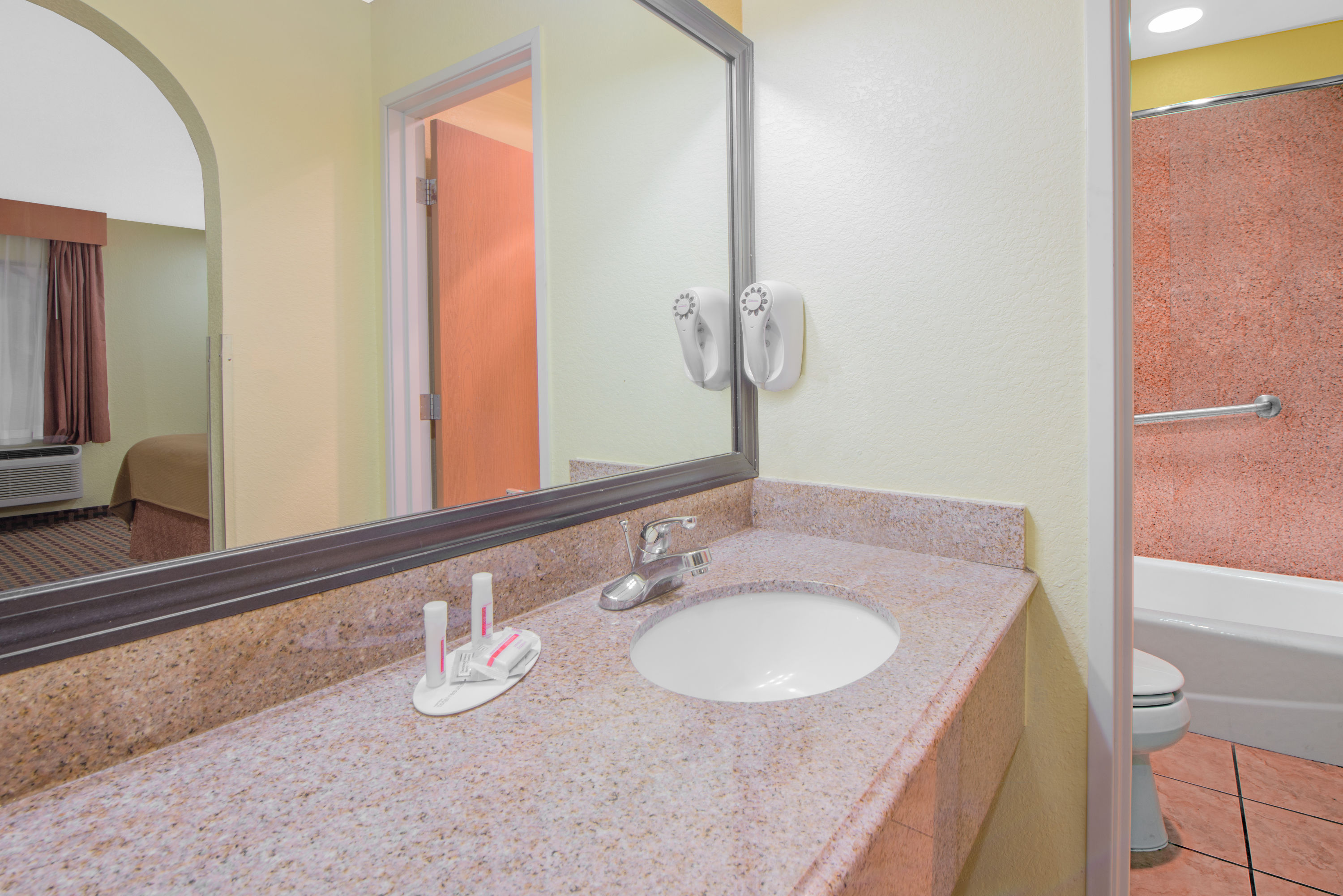 Guest room bath at the Days Inn by Wyndham Lubbock South in Lubbock, Texas