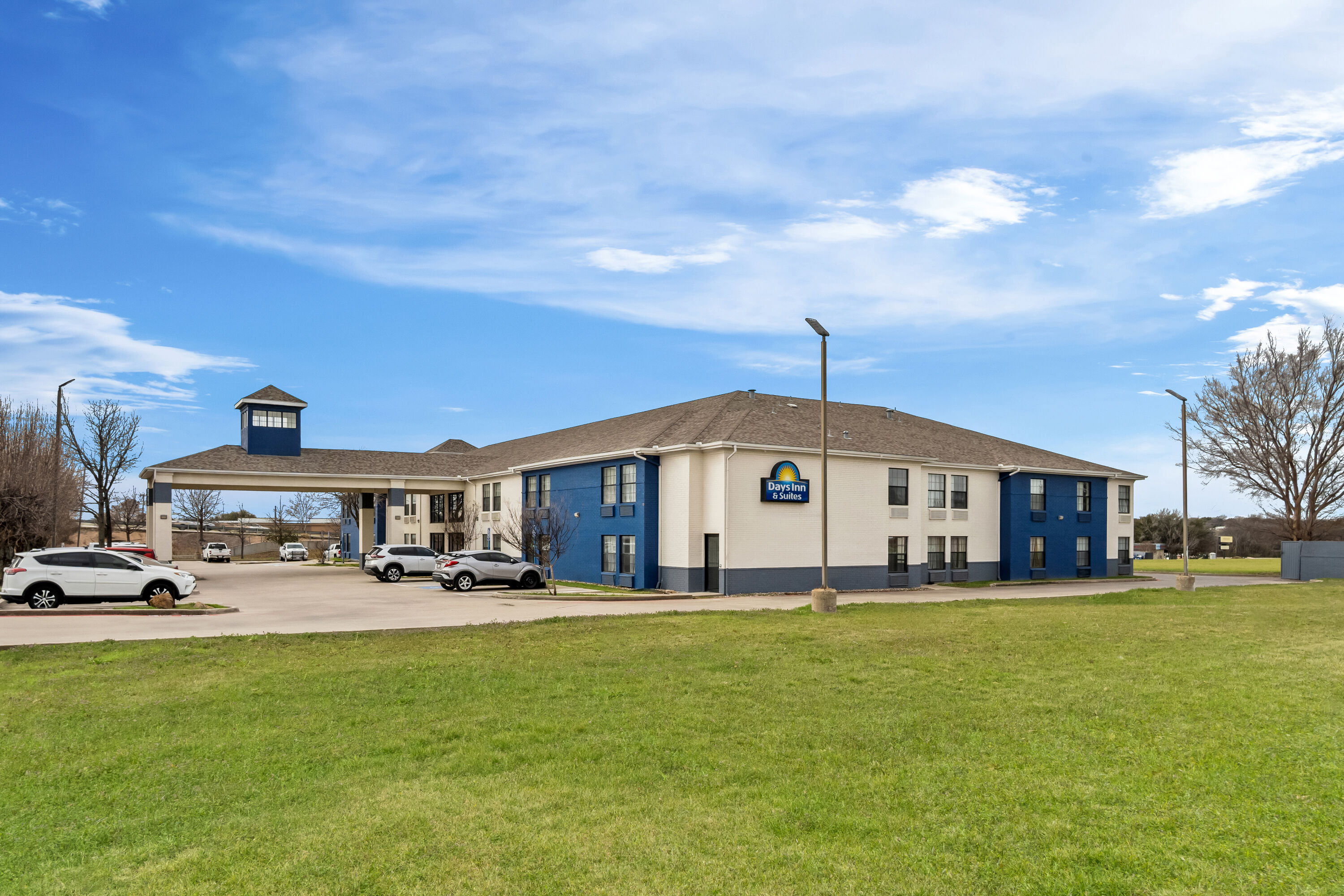 Exterior Day Image of Days Inn by Wyndham Dallas Plano hotel in Plano, Texas
