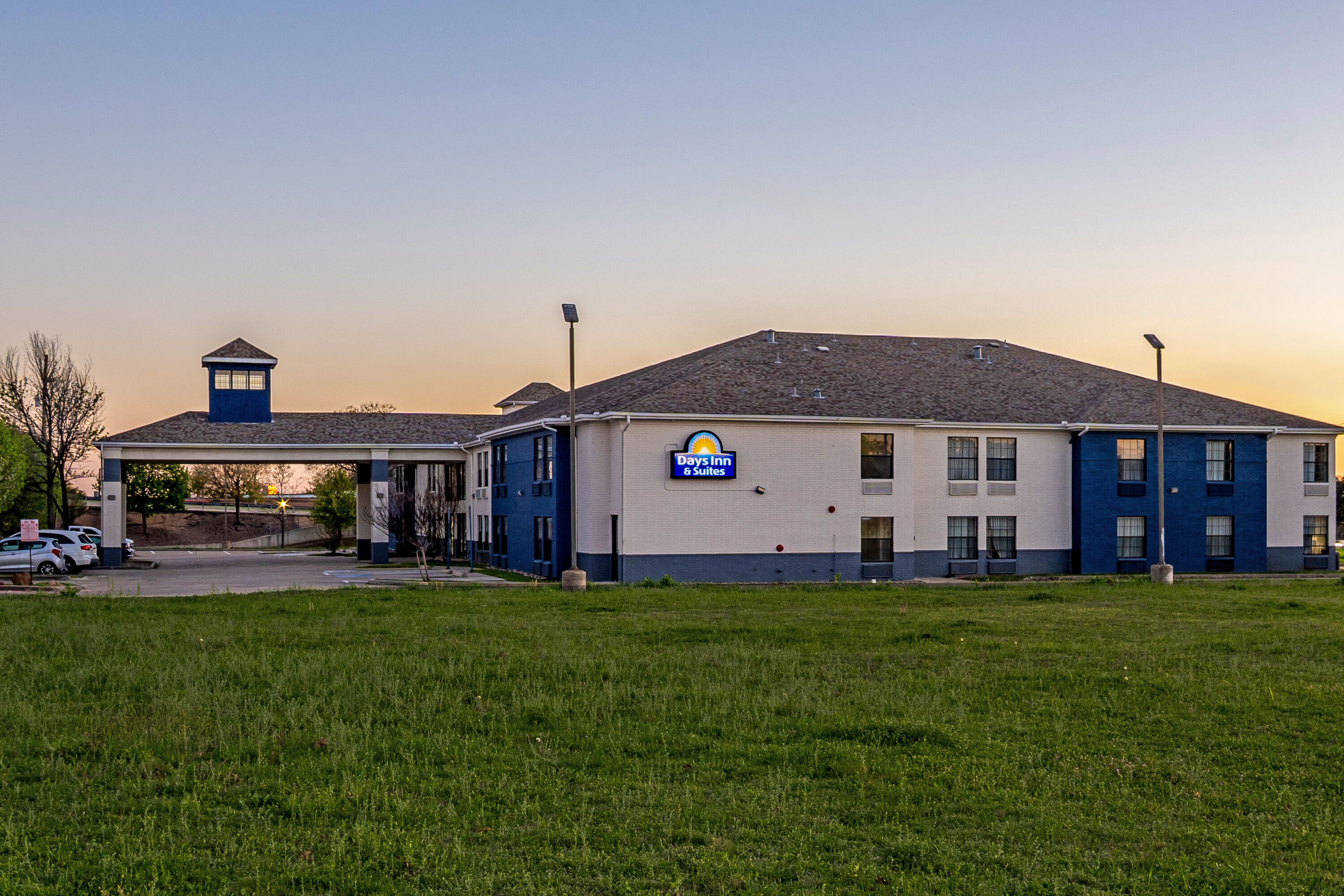 Exterior Night Image of Days Inn by Wyndham Dallas Plano hotel in Plano, Texas