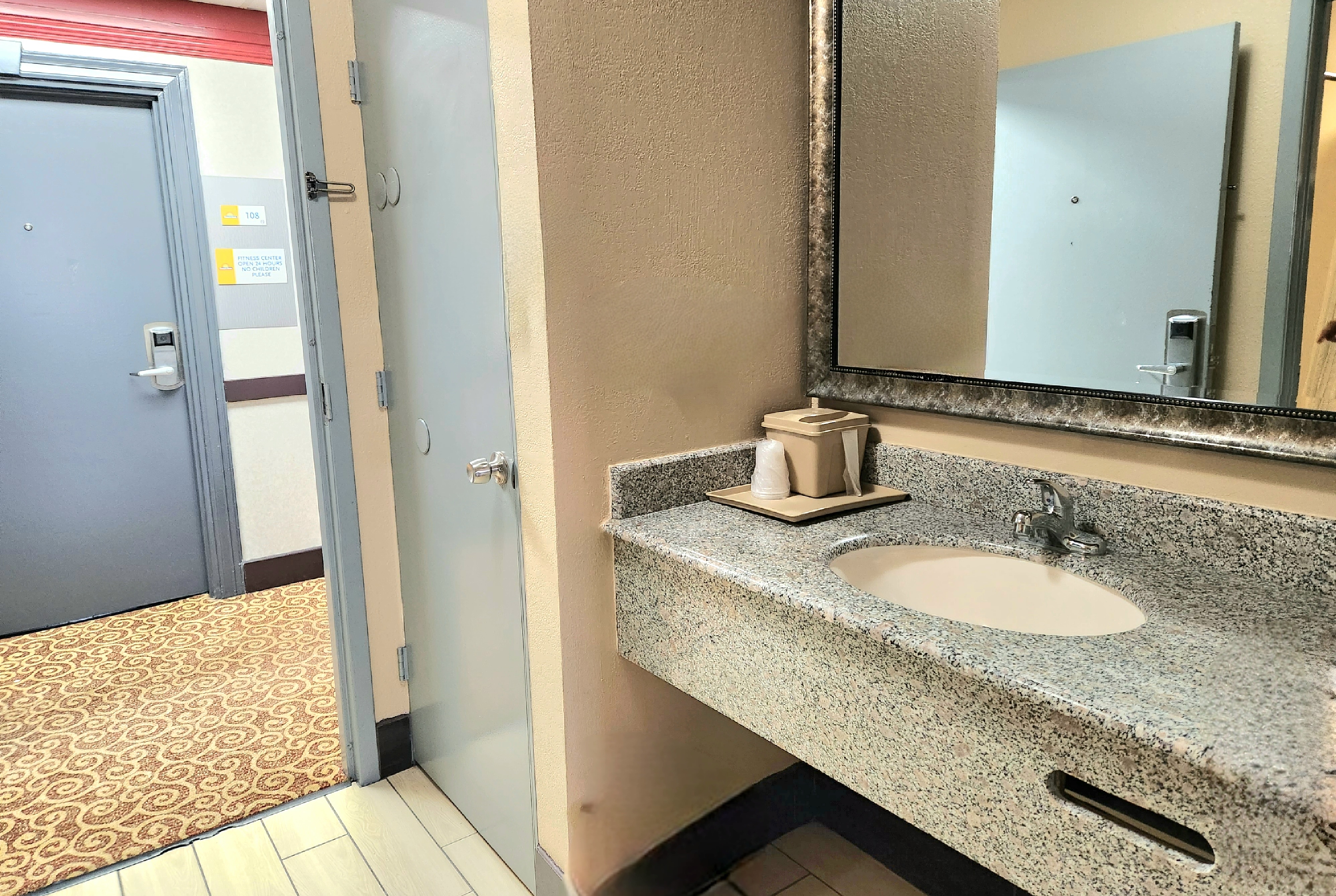 Guest room bath at the Days Inn by Wyndham Rosenberg in Rosenberg, Texas