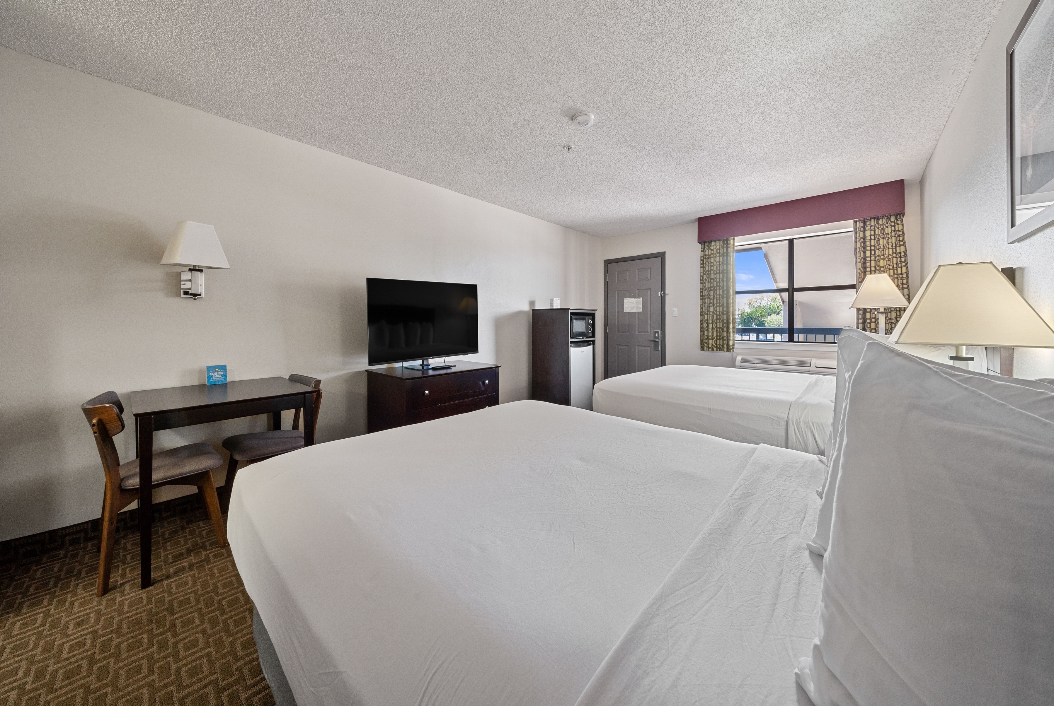 Guest room at the Days Inn by Wyndham Round Rock in Round Rock, Texas