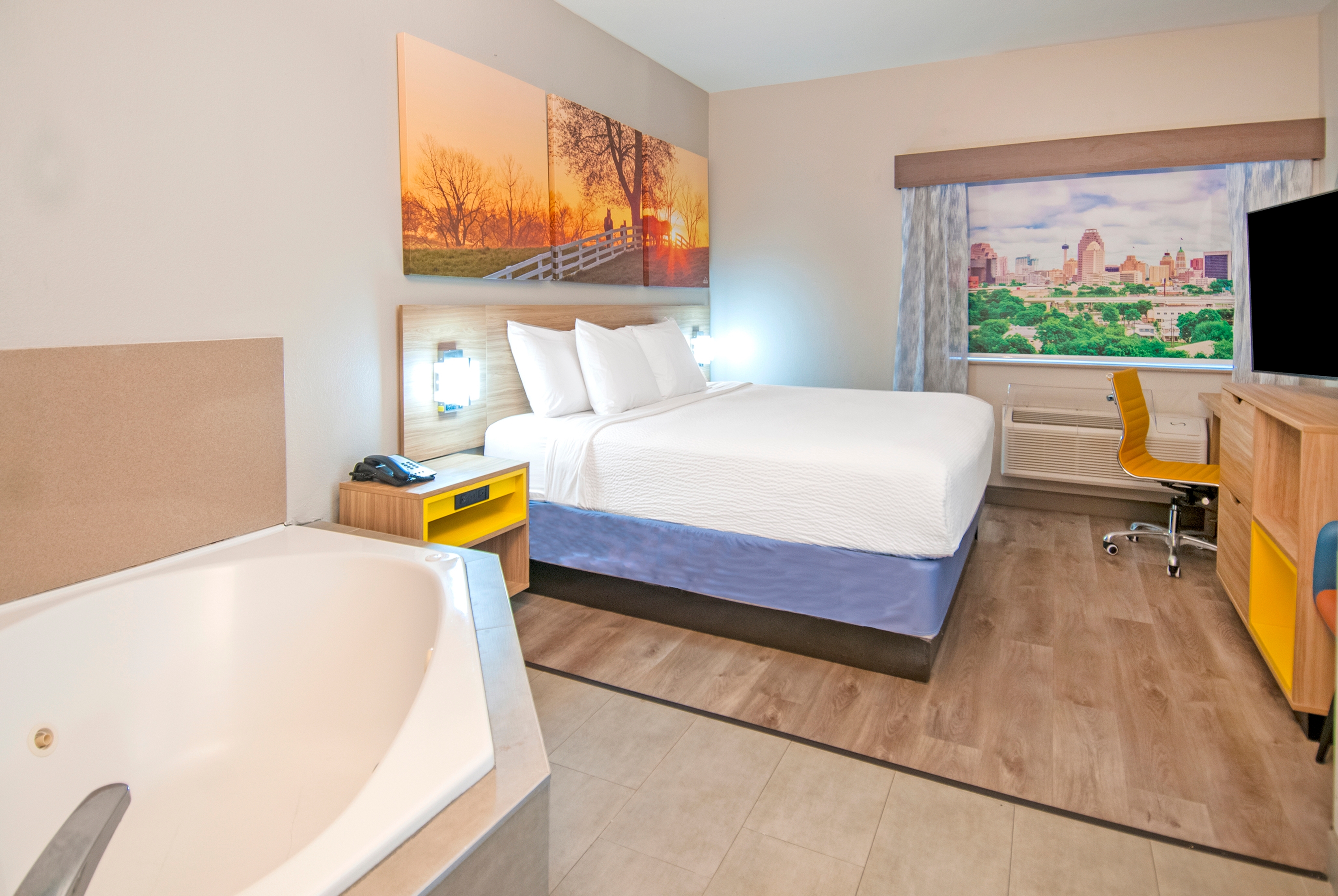 Guest room at the Days Inn & Suites by Wyndham San Antonio North Stone Oak in San Antonio, Texas