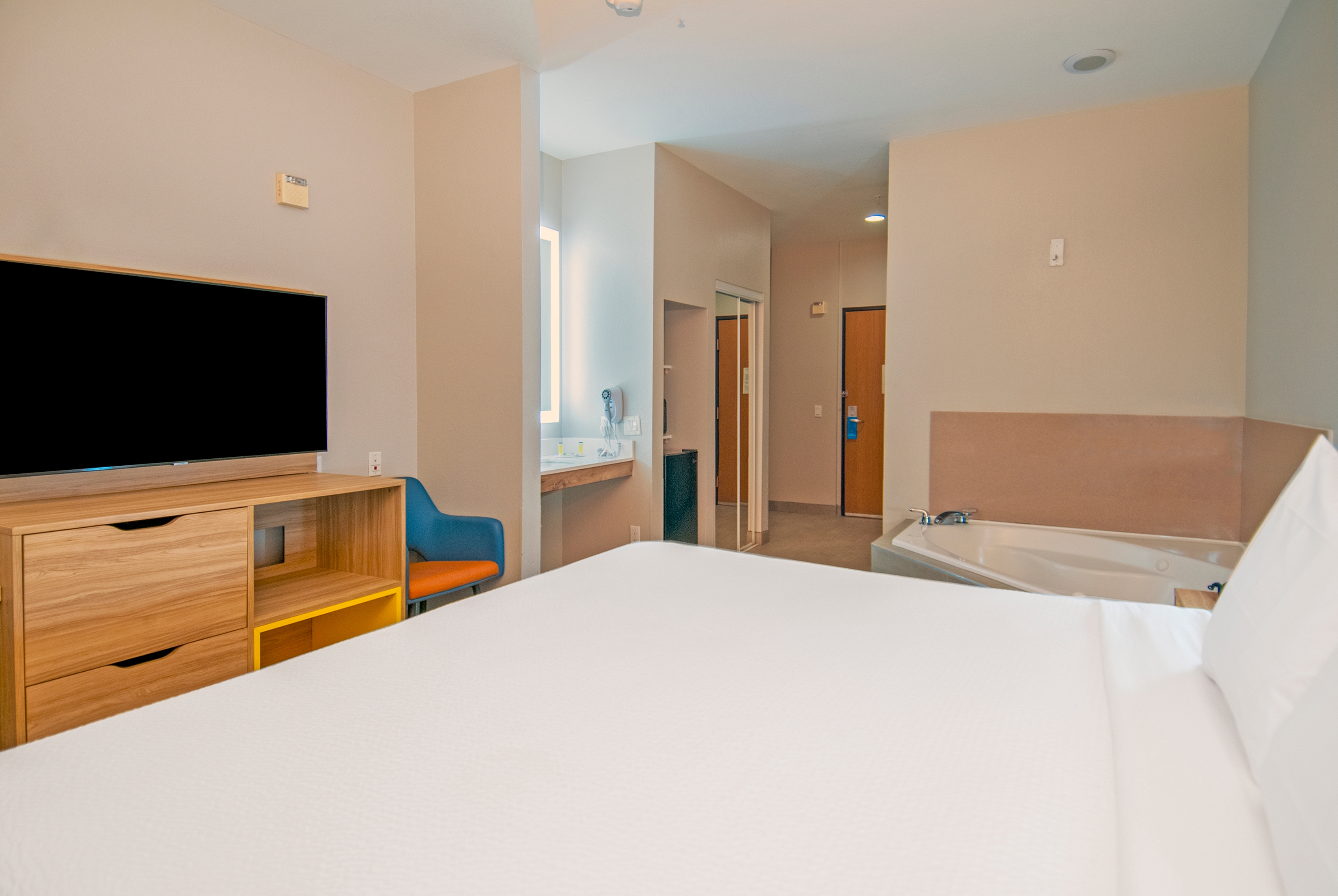 Guest room at the Days Inn & Suites by Wyndham San Antonio North Stone Oak in San Antonio, Texas