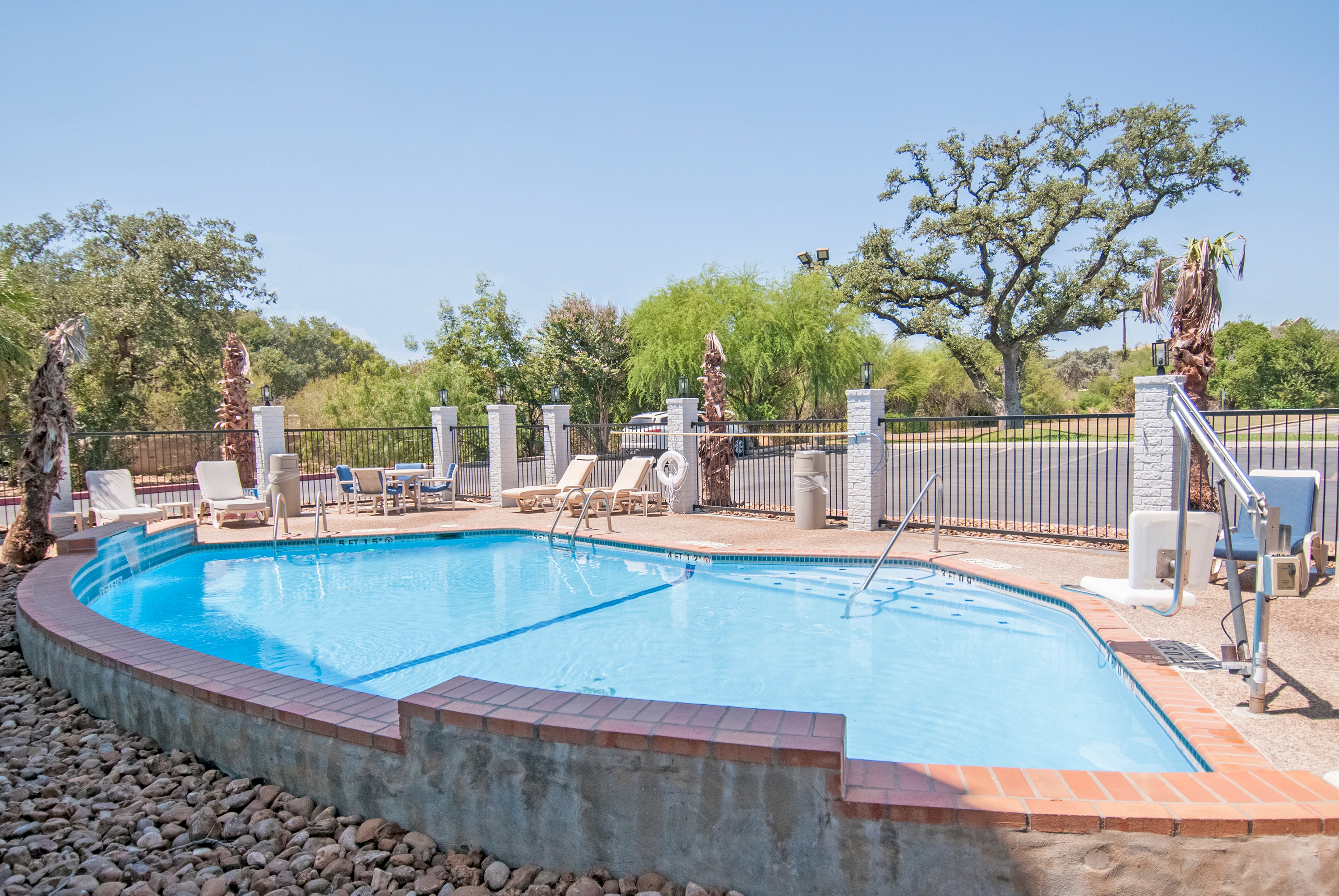 Pool at the Days Inn & Suites by Wyndham San Antonio North Stone Oak in San Antonio, Texas