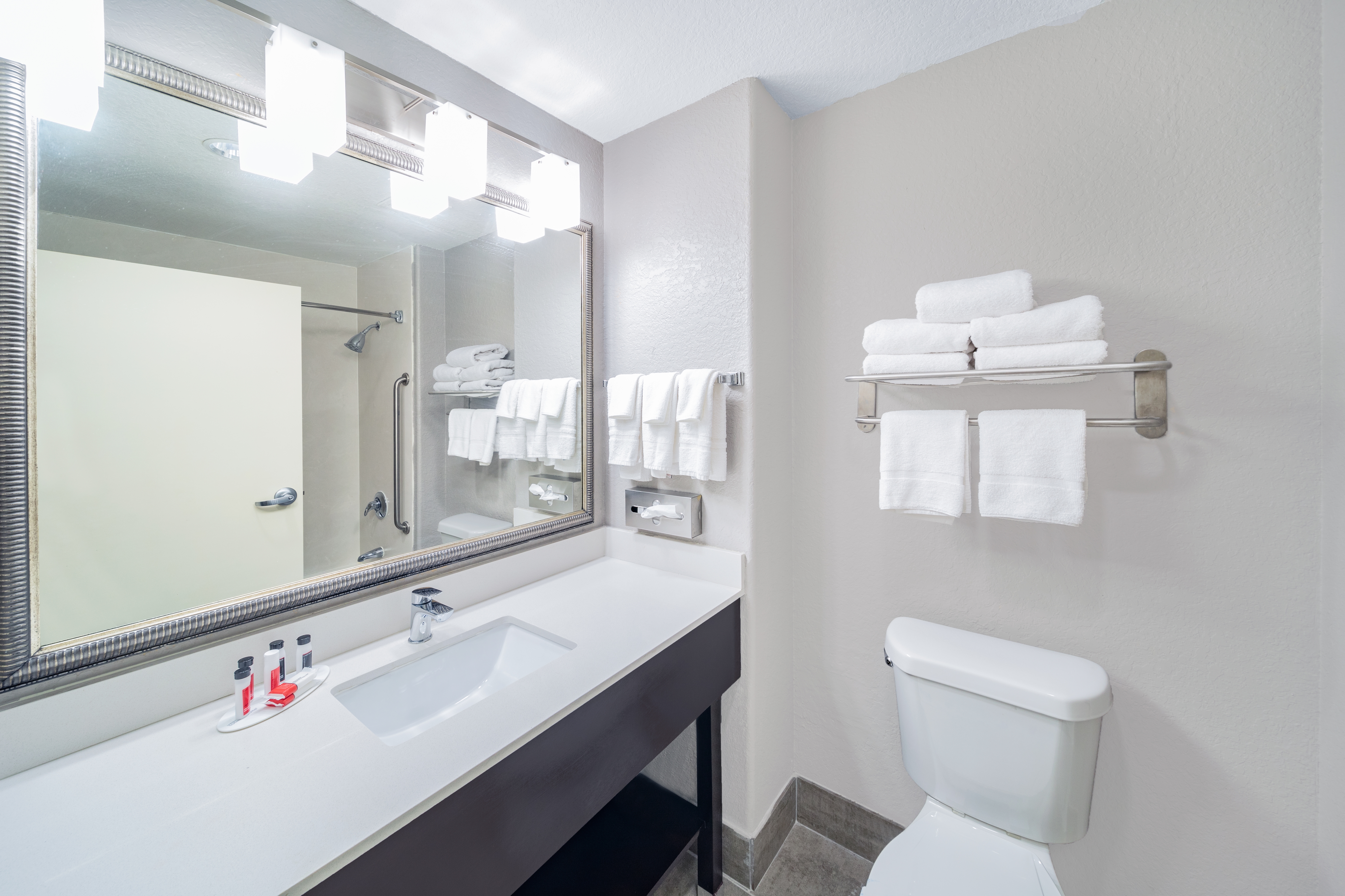 Guest room bath at the Days Inn & Suites by Wyndham San Antonio near Frost Bank Ctr in San Antonio, Texas
