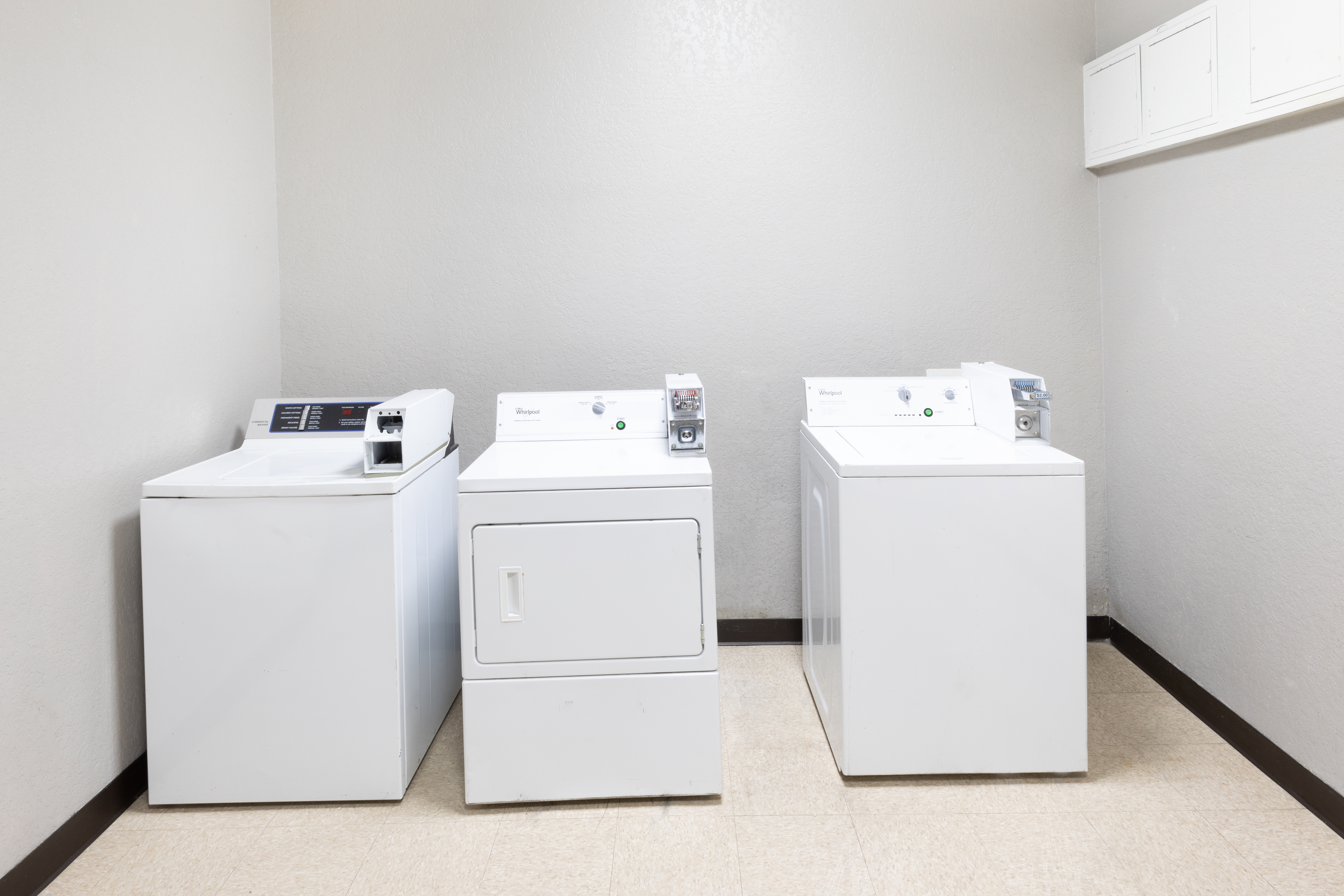 Laundry facilities at Days Inn & Suites by Wyndham San Antonio near Frost Bank Ctr in San Antonio, Texas