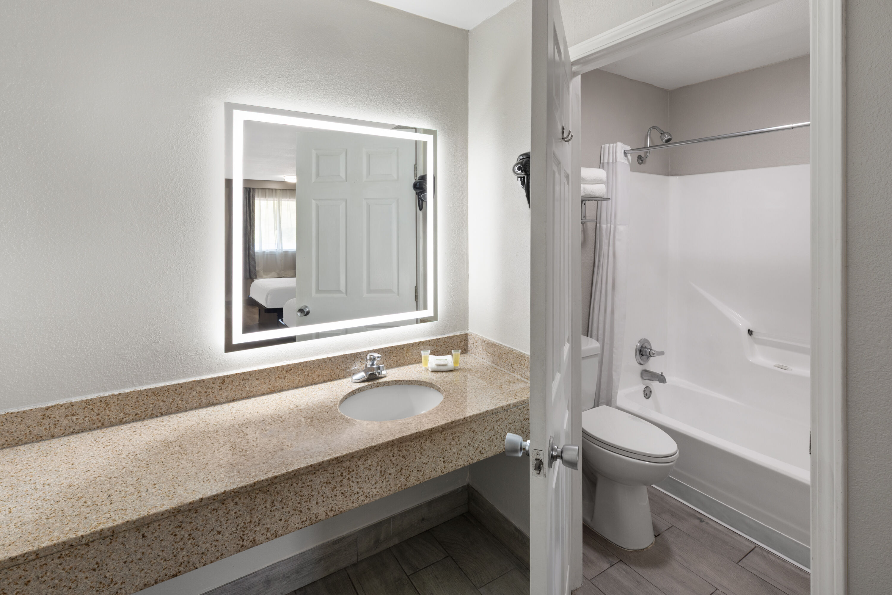 Guest room bath at the Days Inn by Wyndham Temple in Temple, Texas